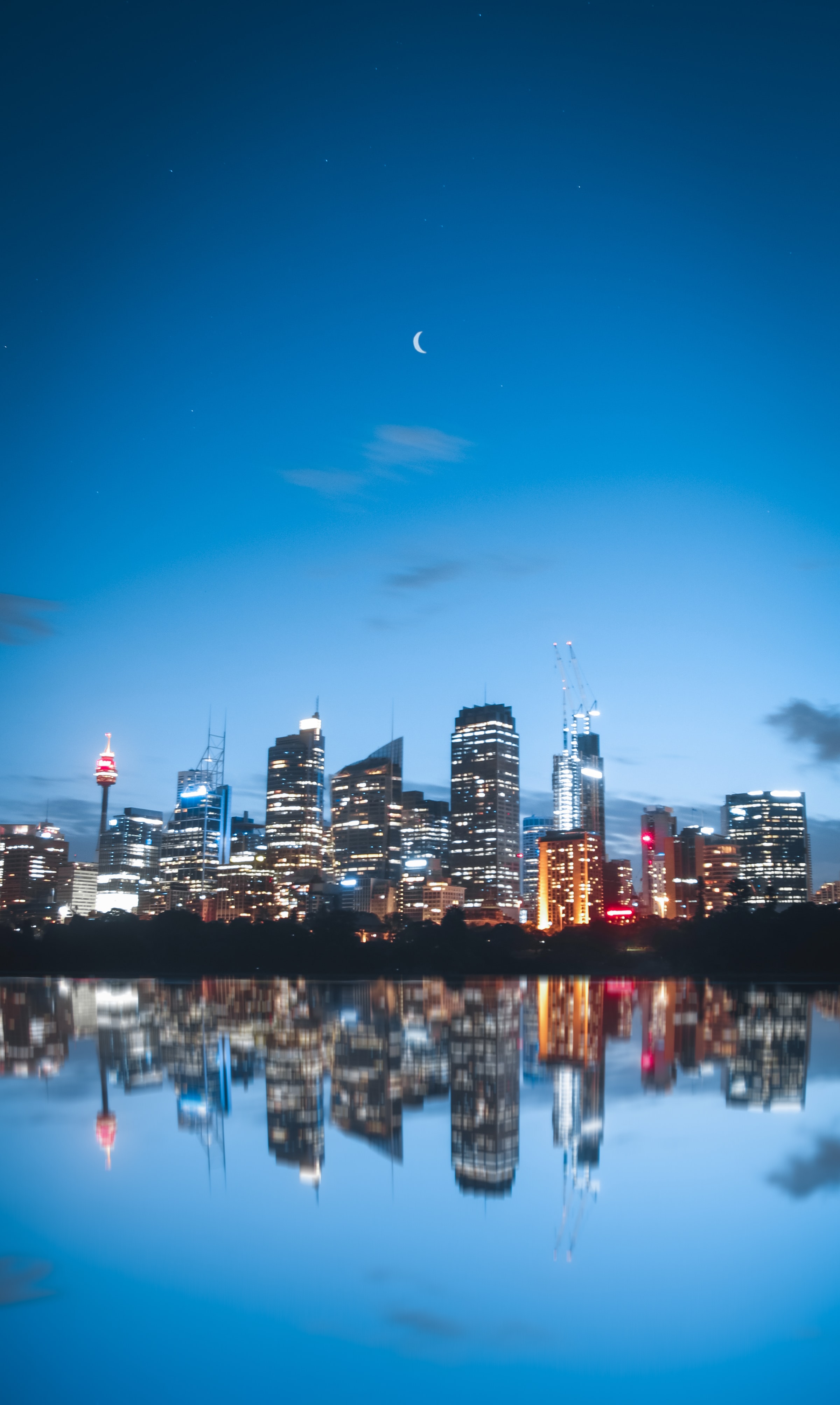 Moon building, lights, reflection, night city 1366x768 Wallpapers