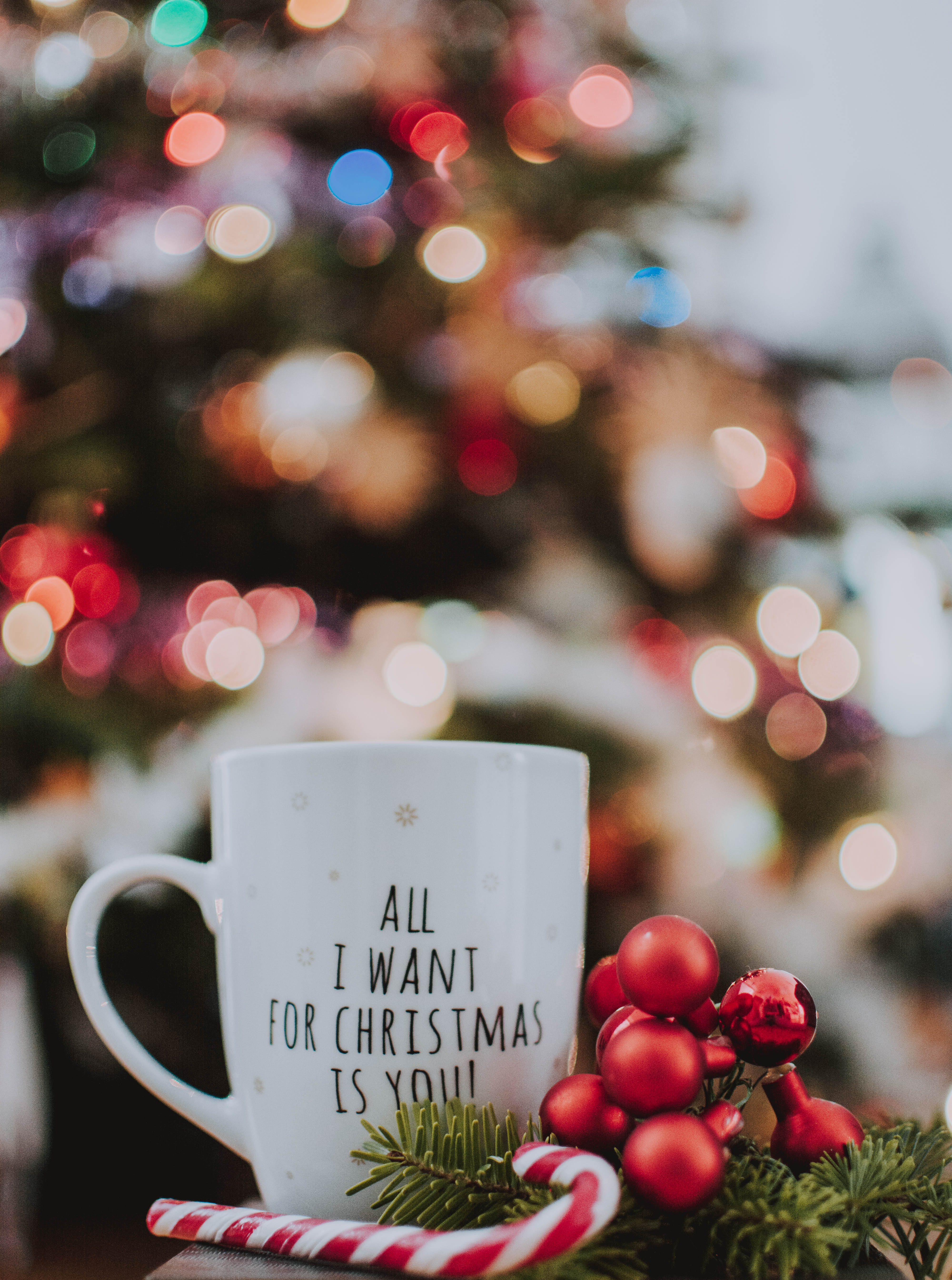 83944 download wallpaper christmas, holidays, new year, glare, cup, inscription, bokeh, boquet, mug screensavers and pictures for free