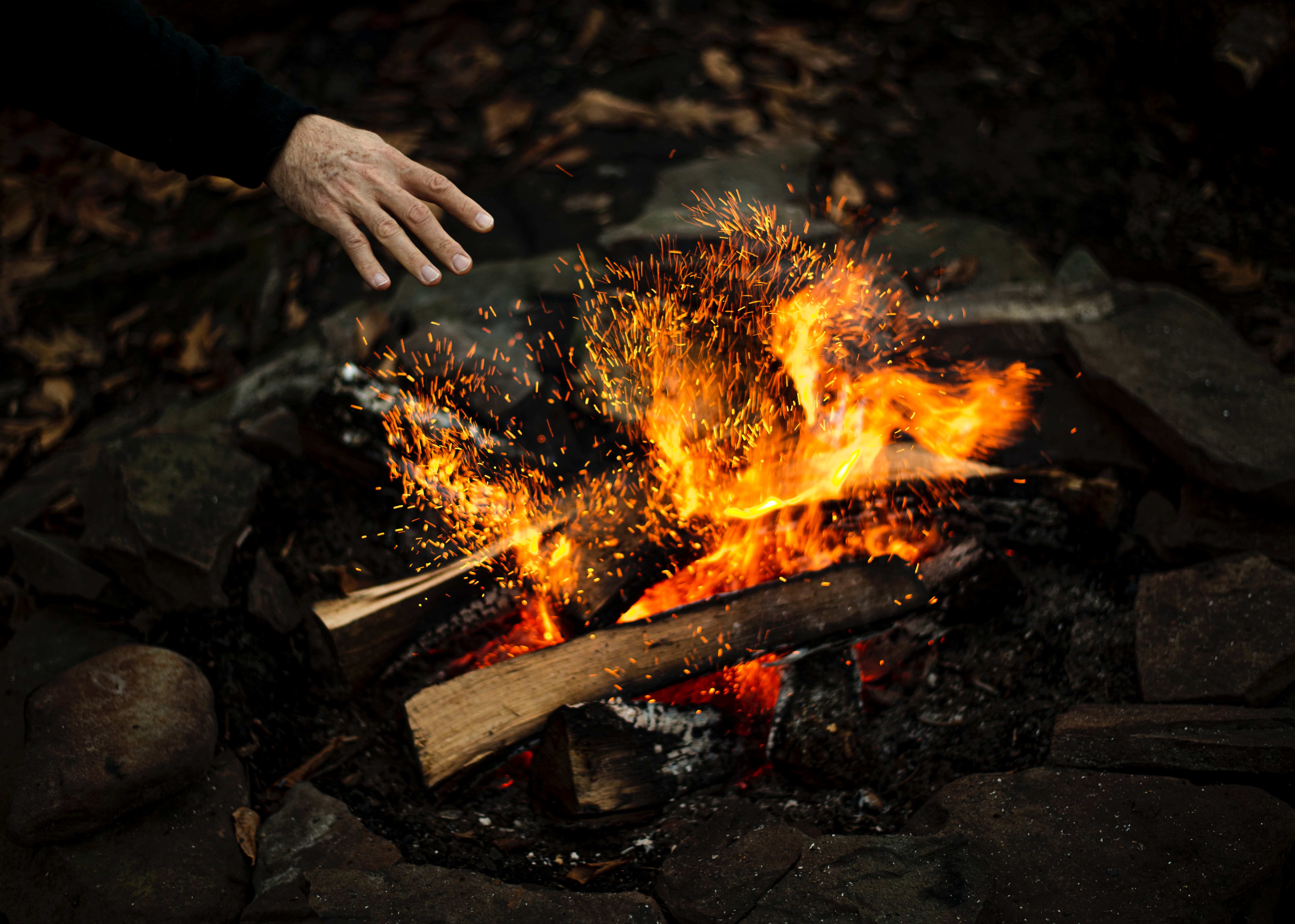 bonfire, fire, hand, sparks, miscellanea, miscellaneous Smartphone Background