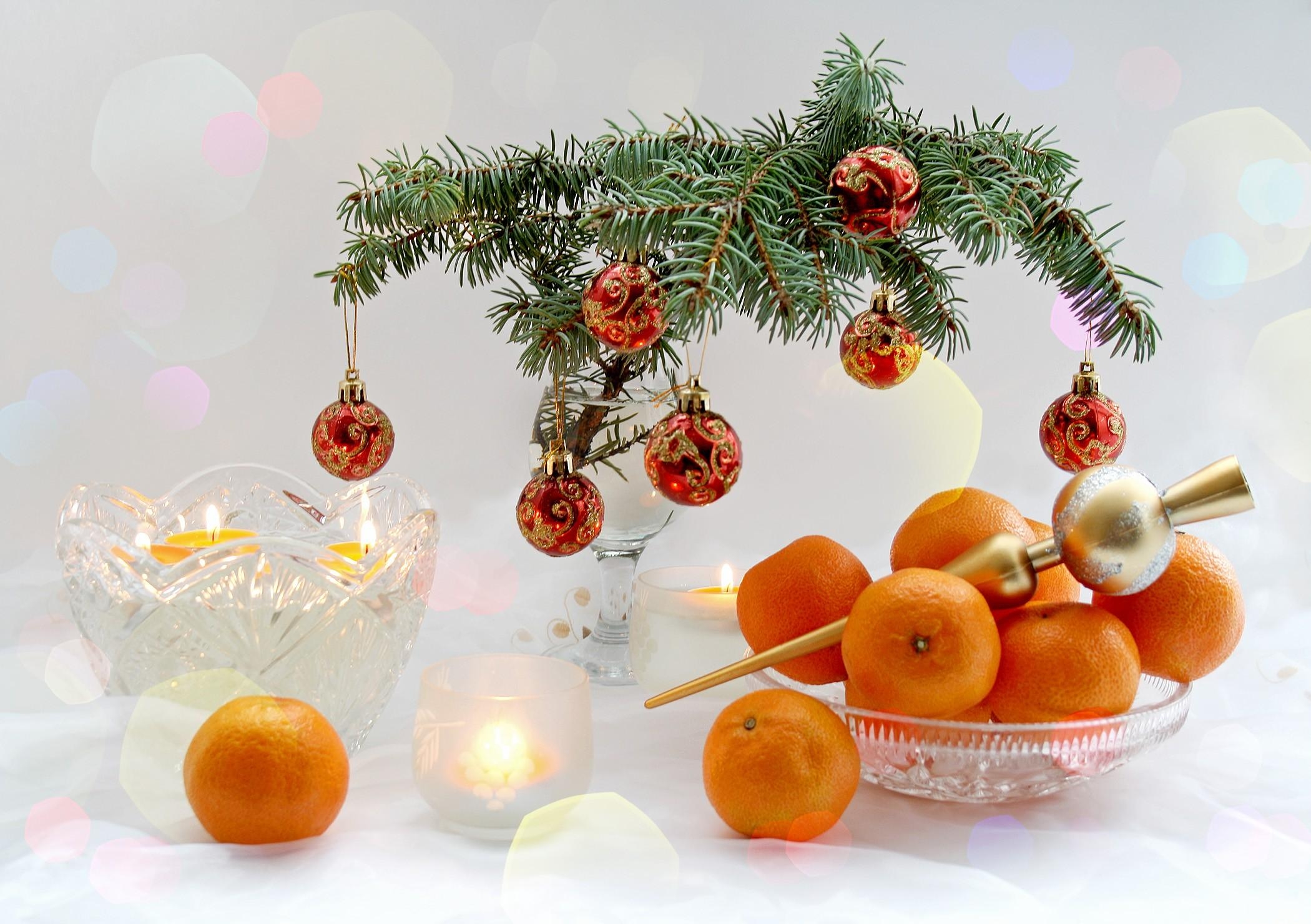 Download mobile wallpaper Holidays, Candles, New Year, Tangerines, Christmas, Branch, Table, Treats for free.