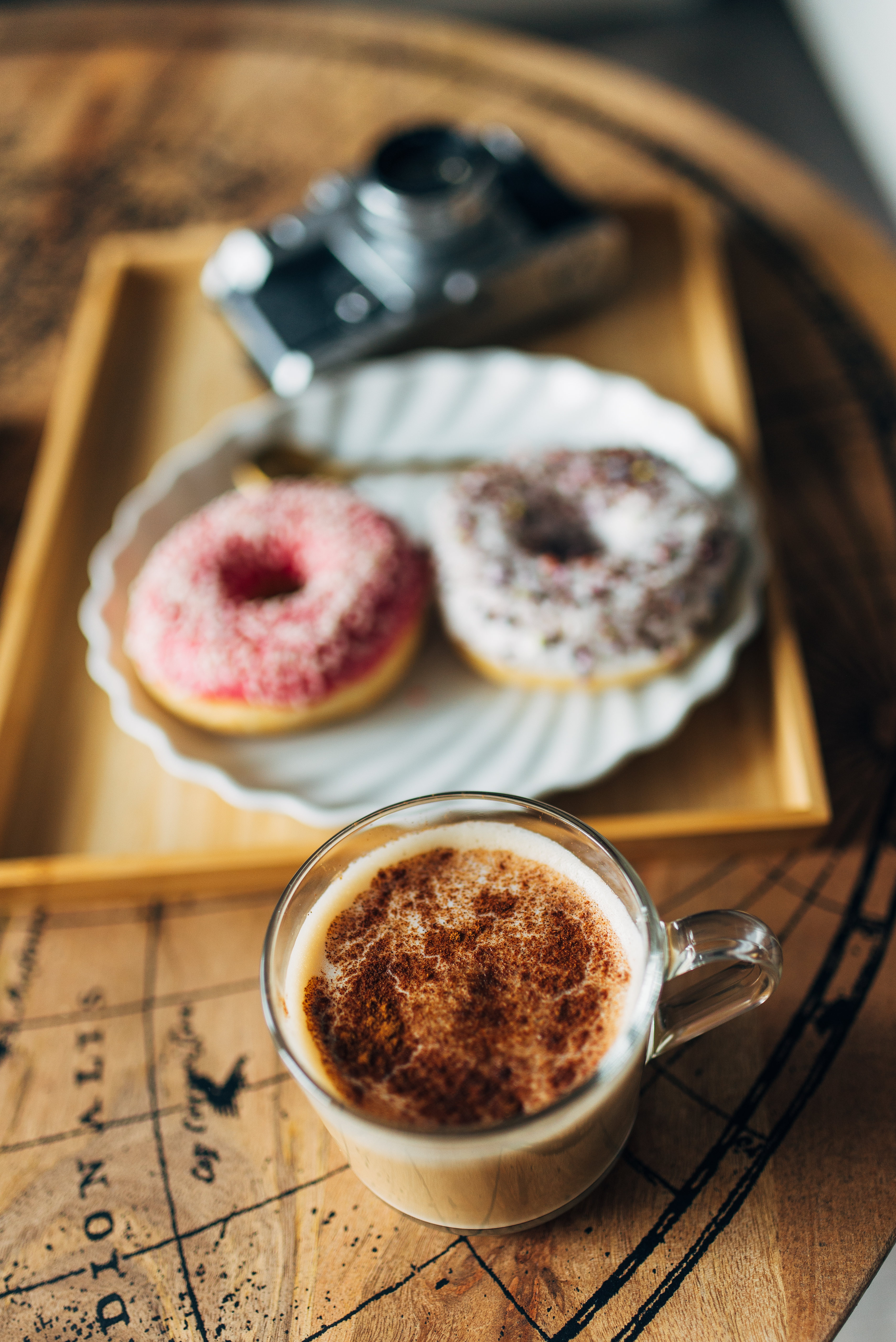 92171 download wallpaper food, coffee, cup, table, camera, donuts screensavers and pictures for free