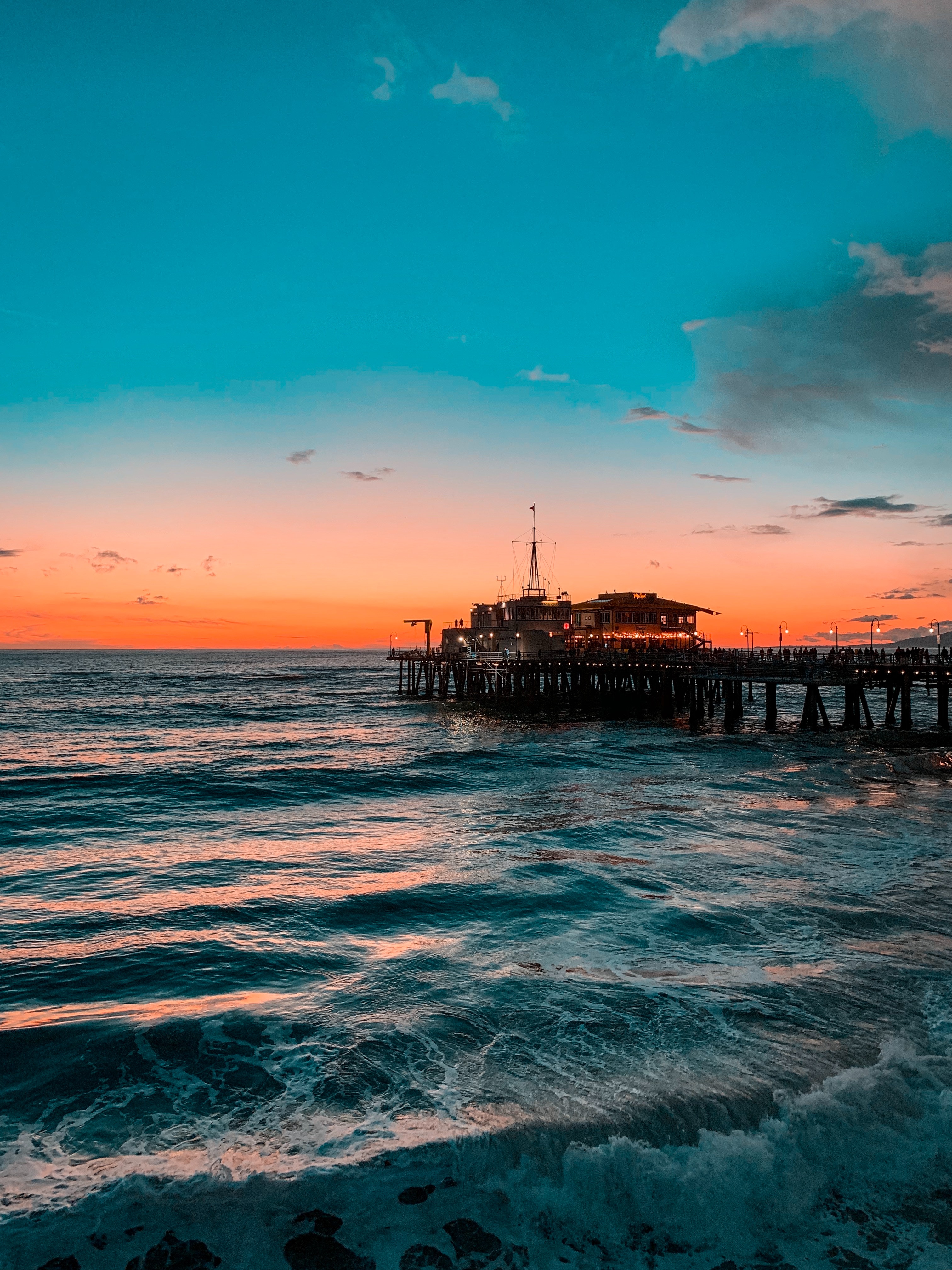 Download mobile wallpaper Ocean, Surf, Nature, Sunset, Waves, Pier for free.
