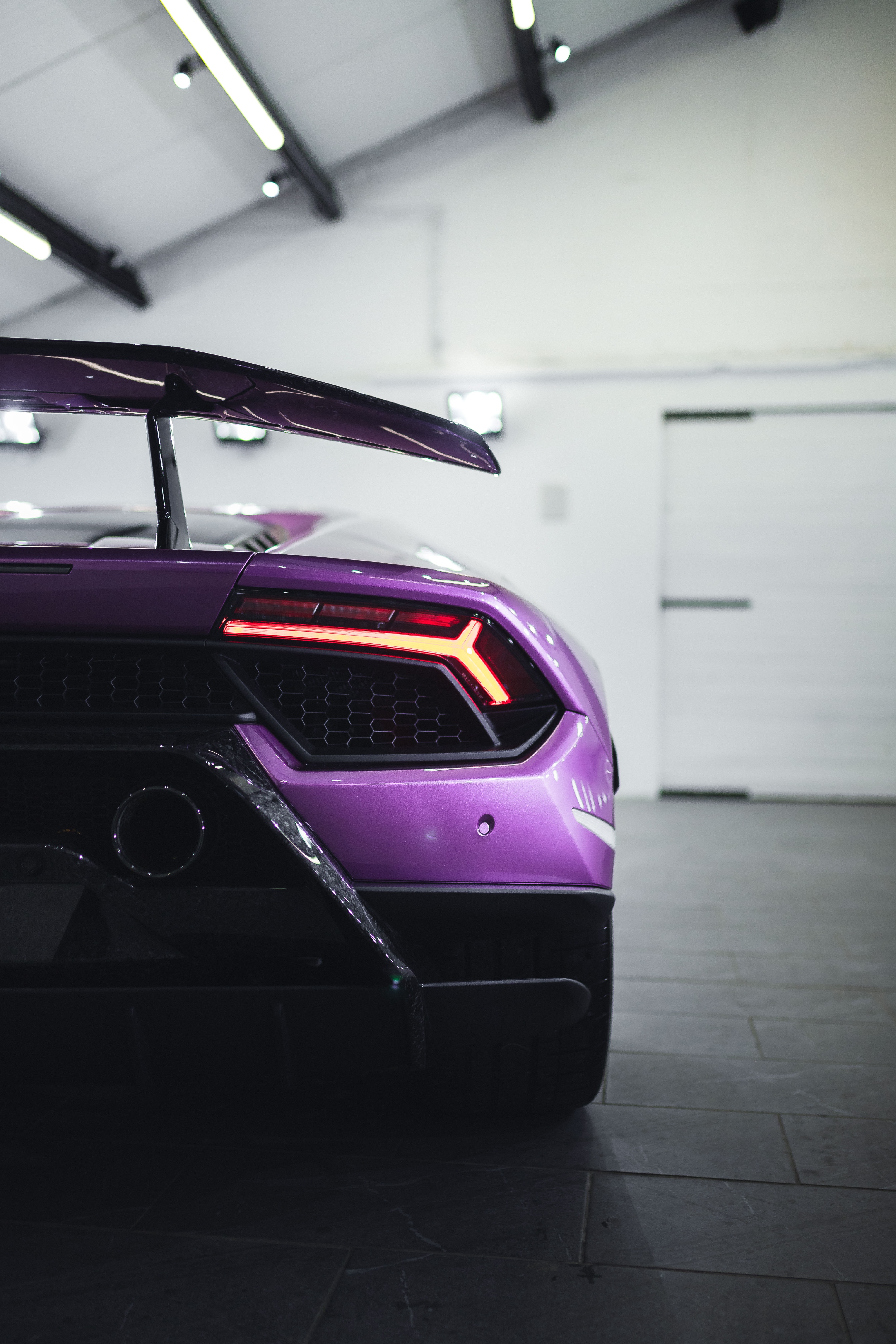 124634 download wallpaper purple, sports, lamborghini, violet, cars, car, sports car, back view, rear view, supercar screensavers and pictures for free