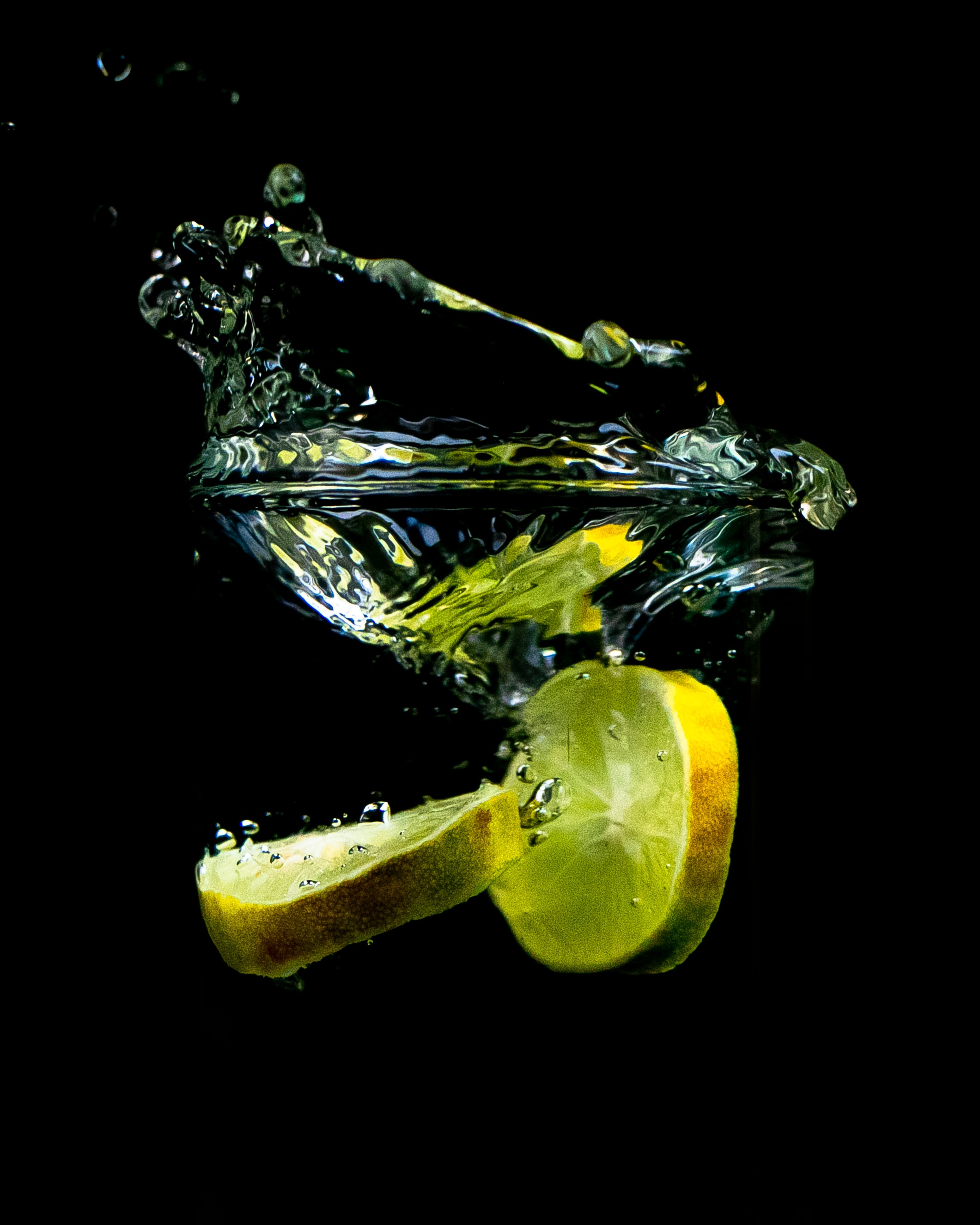 79222 Screensavers and Wallpapers Lemon for phone. Download water, food, black, spray, lemon, lobules, slices pictures for free