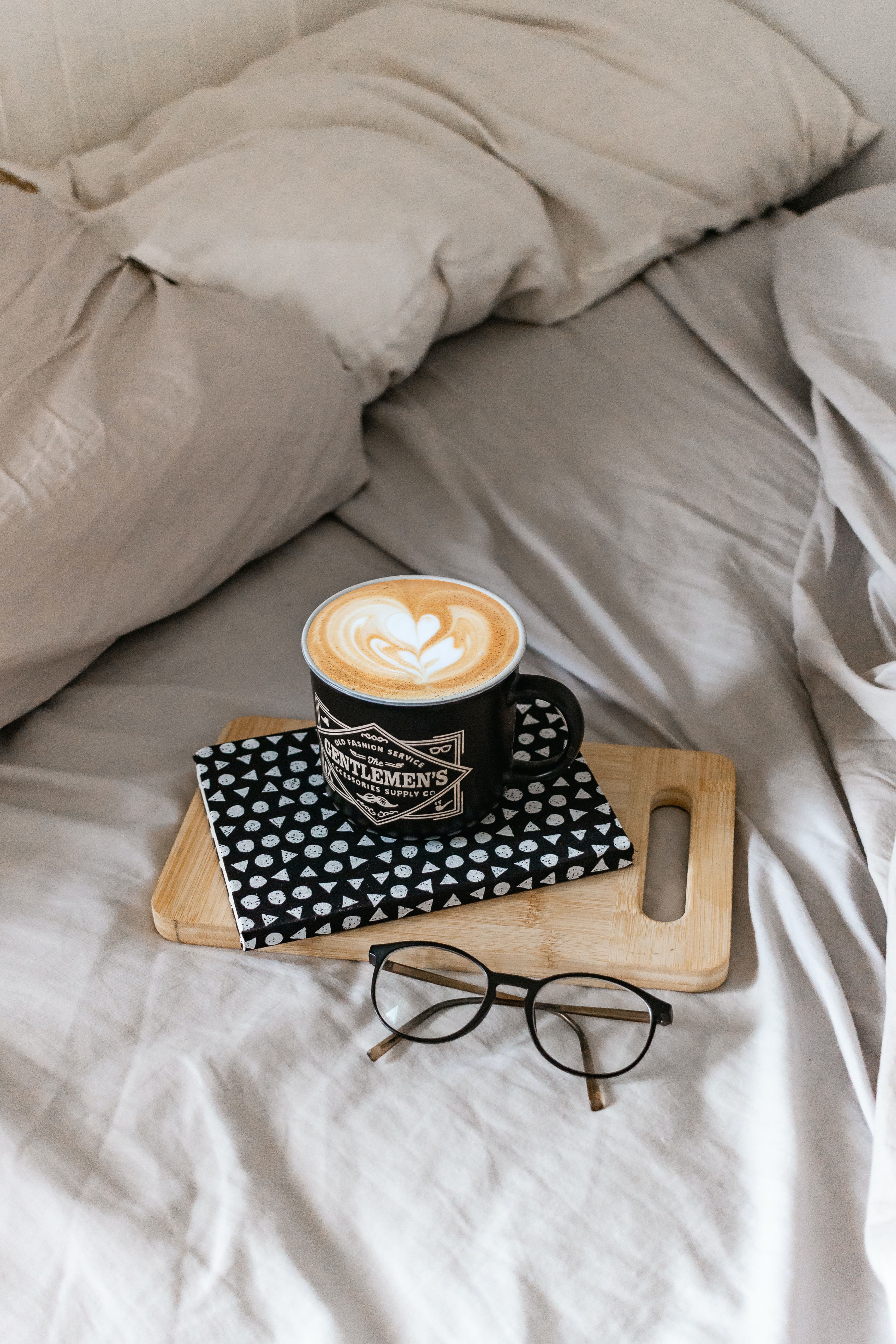 61935 Screensavers and Wallpapers Cappuccino for phone. Download miscellanea, miscellaneous, cup, book, bed, cappuccino, glasses, spectacles pictures for free