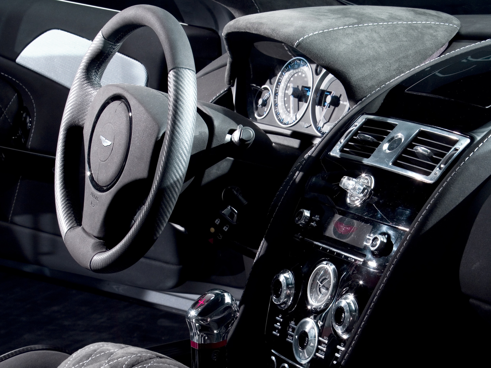 124399 download wallpaper interior, aston martin, cars, black, dbs, steering wheel, rudder, salon, speedometer, 2006 screensavers and pictures for free