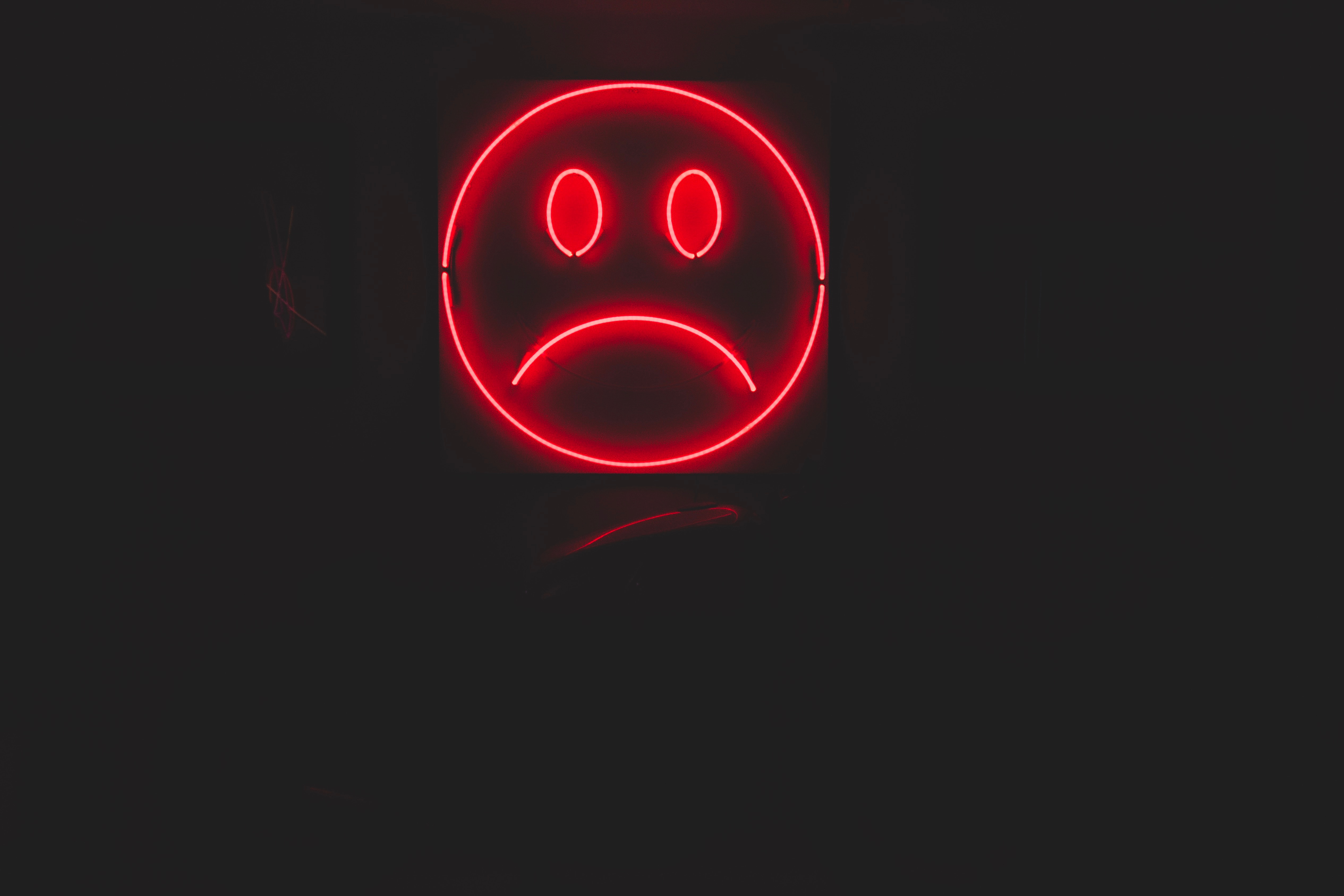 136522 download wallpaper red, dark, neon, smile, sad, emoticon, smiley screensavers and pictures for free