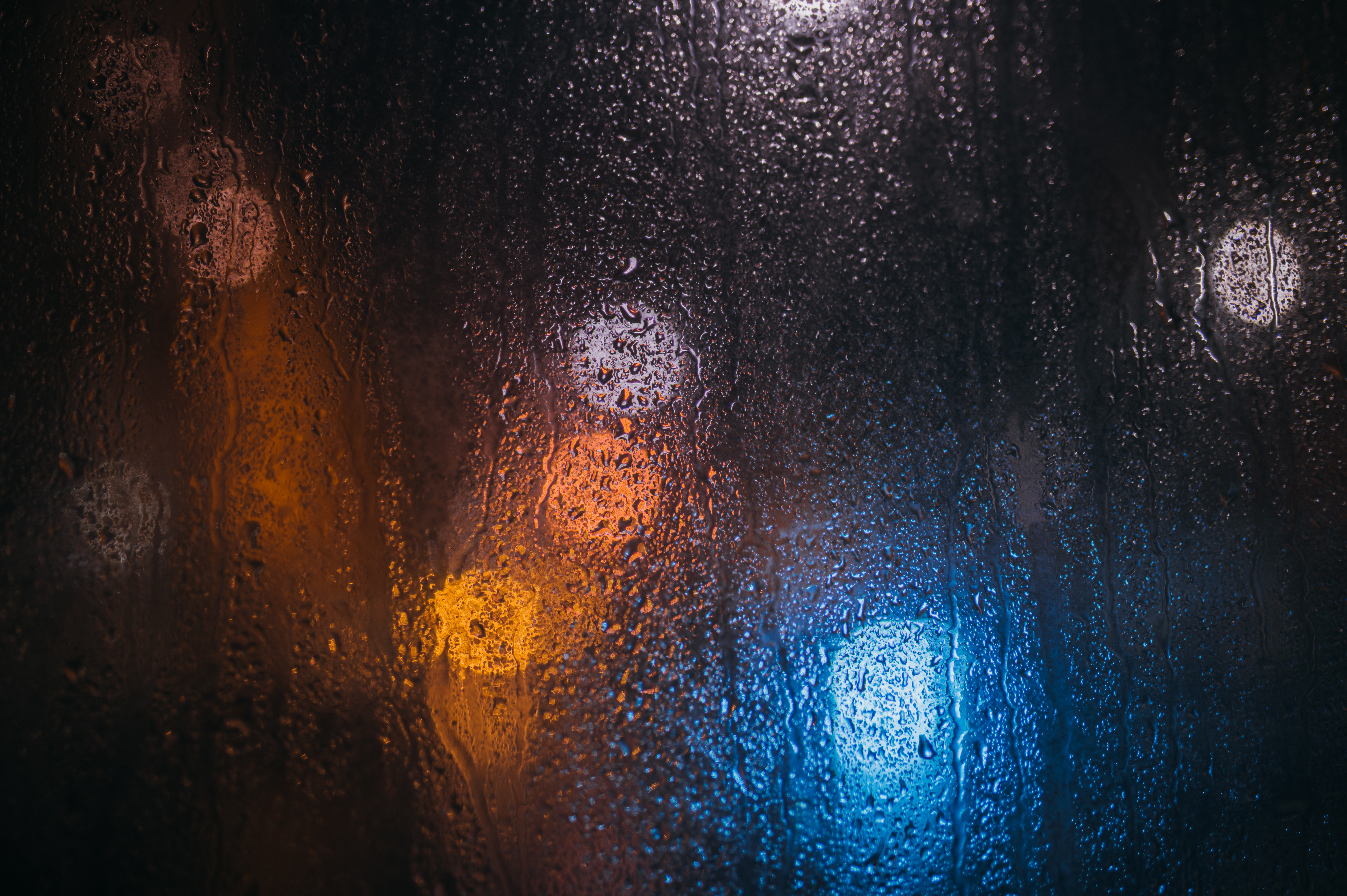 54609 download wallpaper rain, drops, lights, macro, blur, glass screensavers and pictures for free
