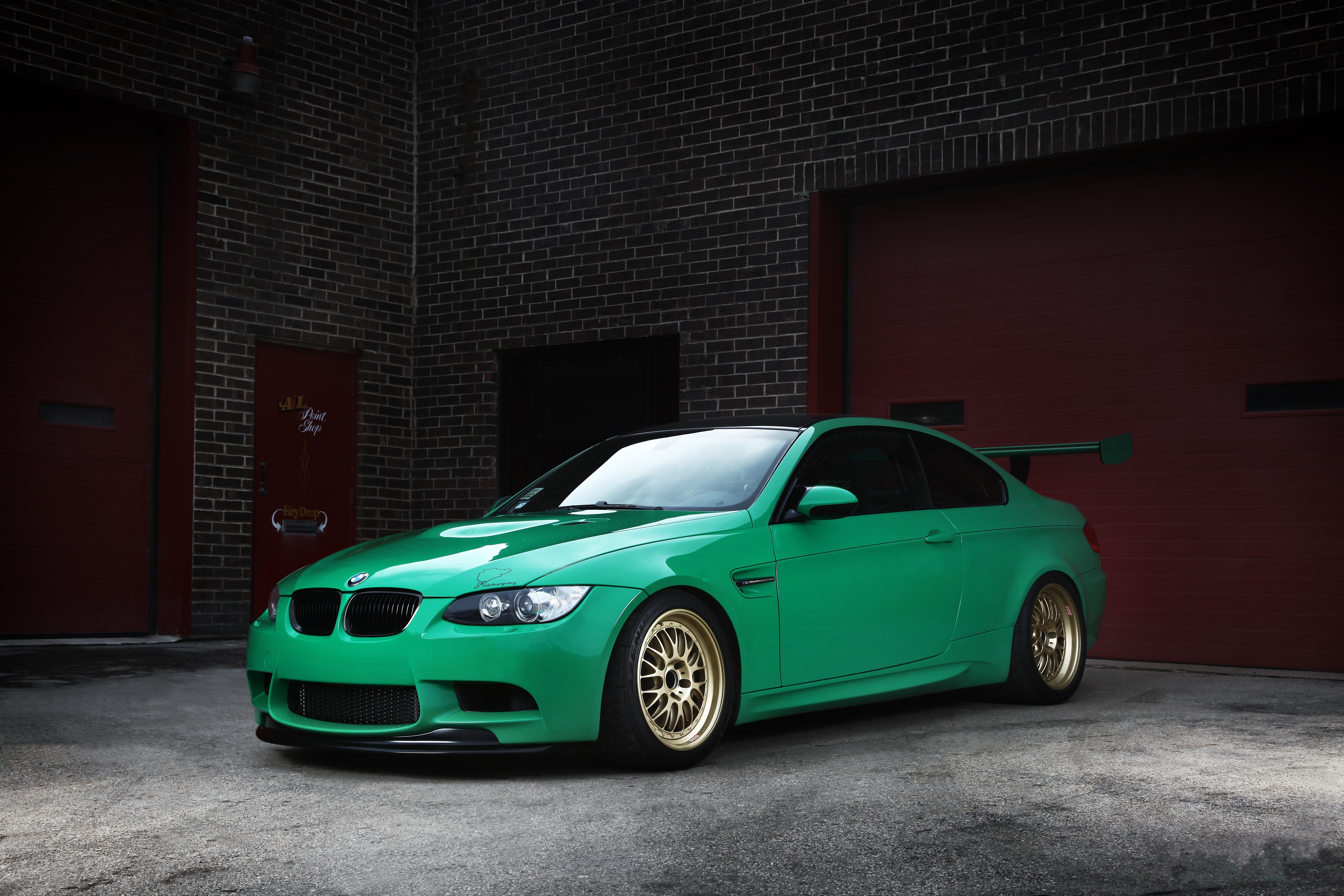 97555 download wallpaper bmw, cars, green, wing, m3, wheels, e92, gate, goal, brick walls screensavers and pictures for free