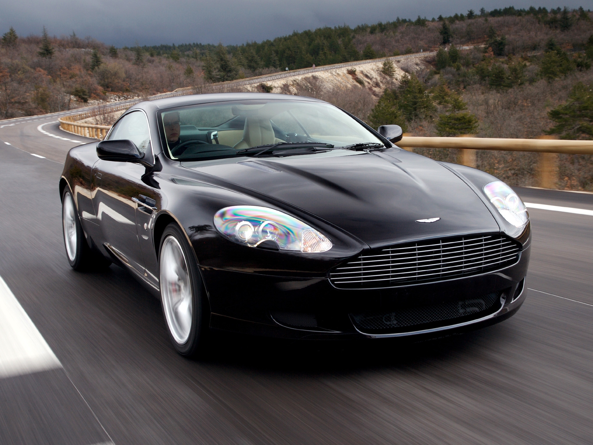102836 download wallpaper sports, auto, nature, trees, aston martin, cars, black, asphalt, front view, speed, style, db9, 2006 screensavers and pictures for free