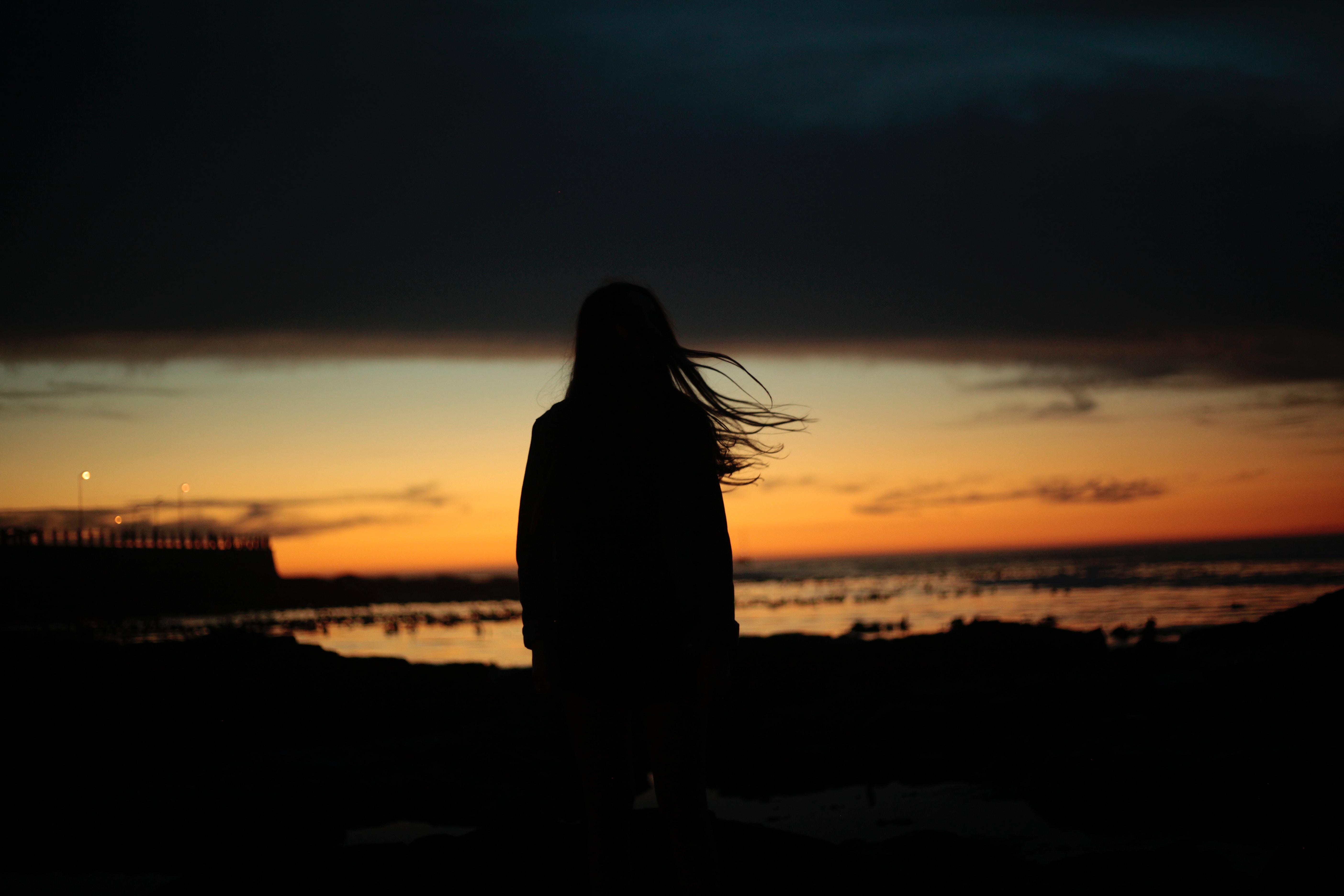 58231 Screensavers and Wallpapers Girl for phone. Download girl, night, dark, silhouette, hair, wind pictures for free