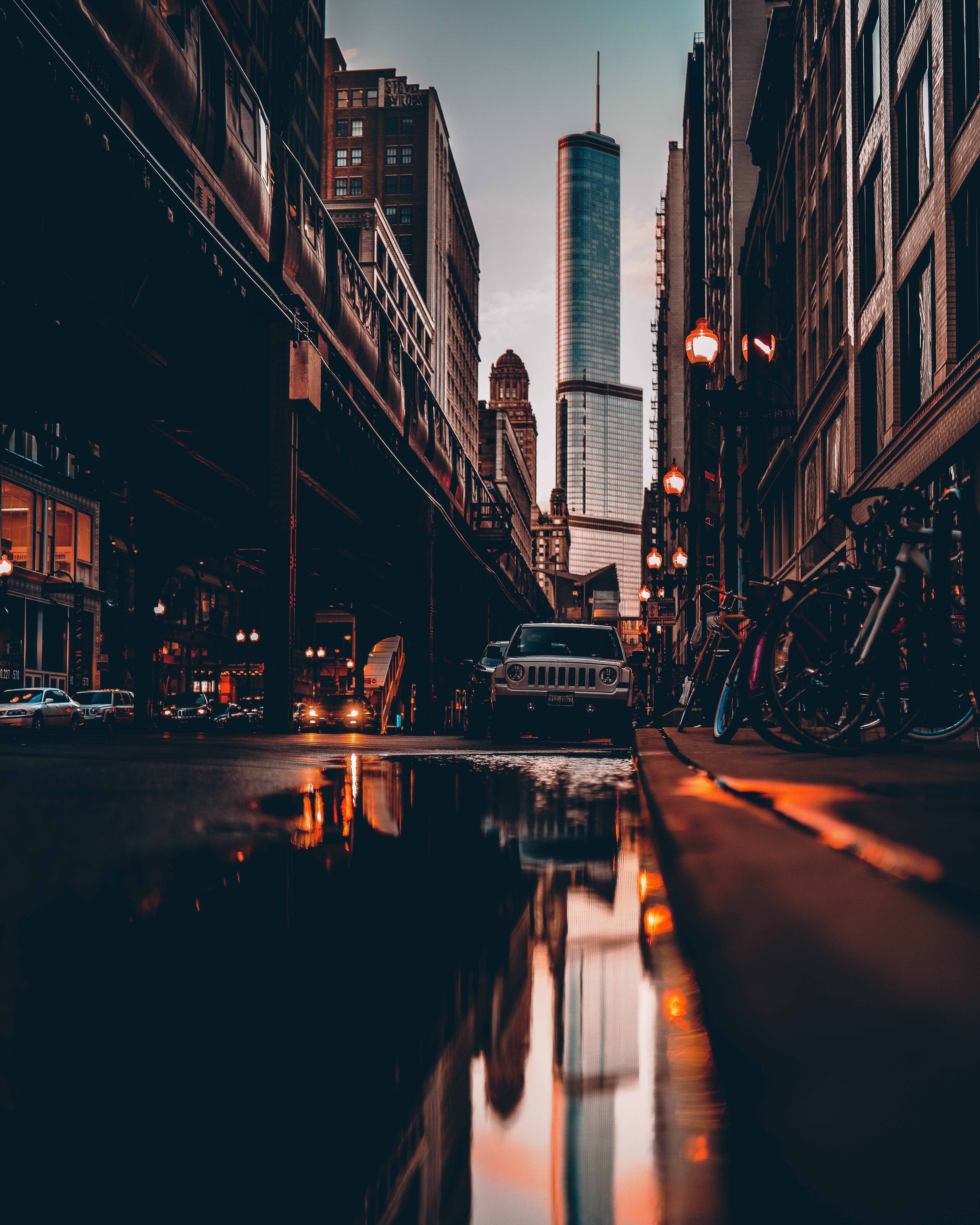 78030 download wallpaper street, cities, auto, bicycles, city, building, reflection, puddle screensavers and pictures for free