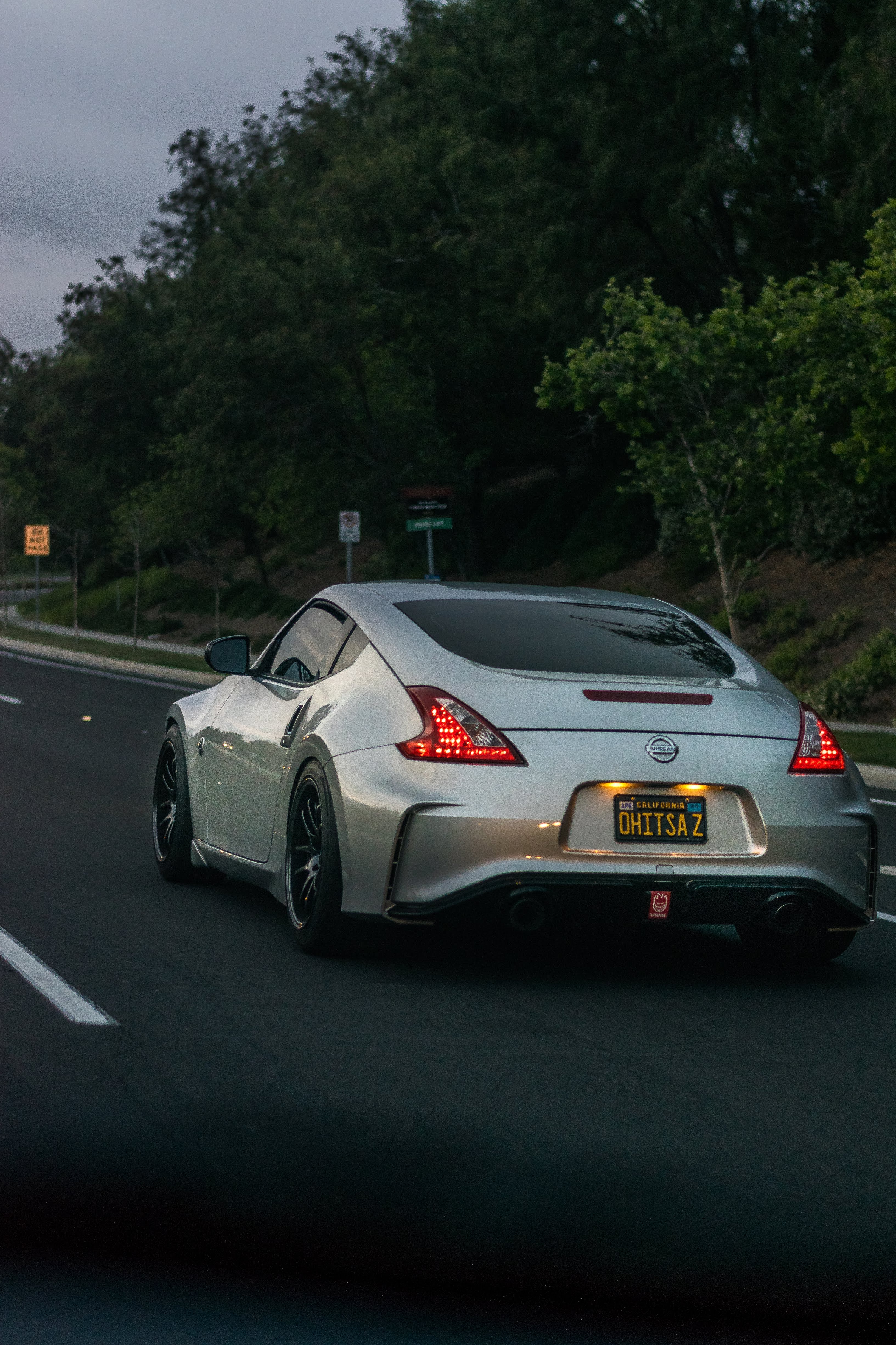 133869 Screensavers and Wallpapers Silvery for phone. Download cars, road, traffic, movement, silver, silvery, nissan 370z pictures for free