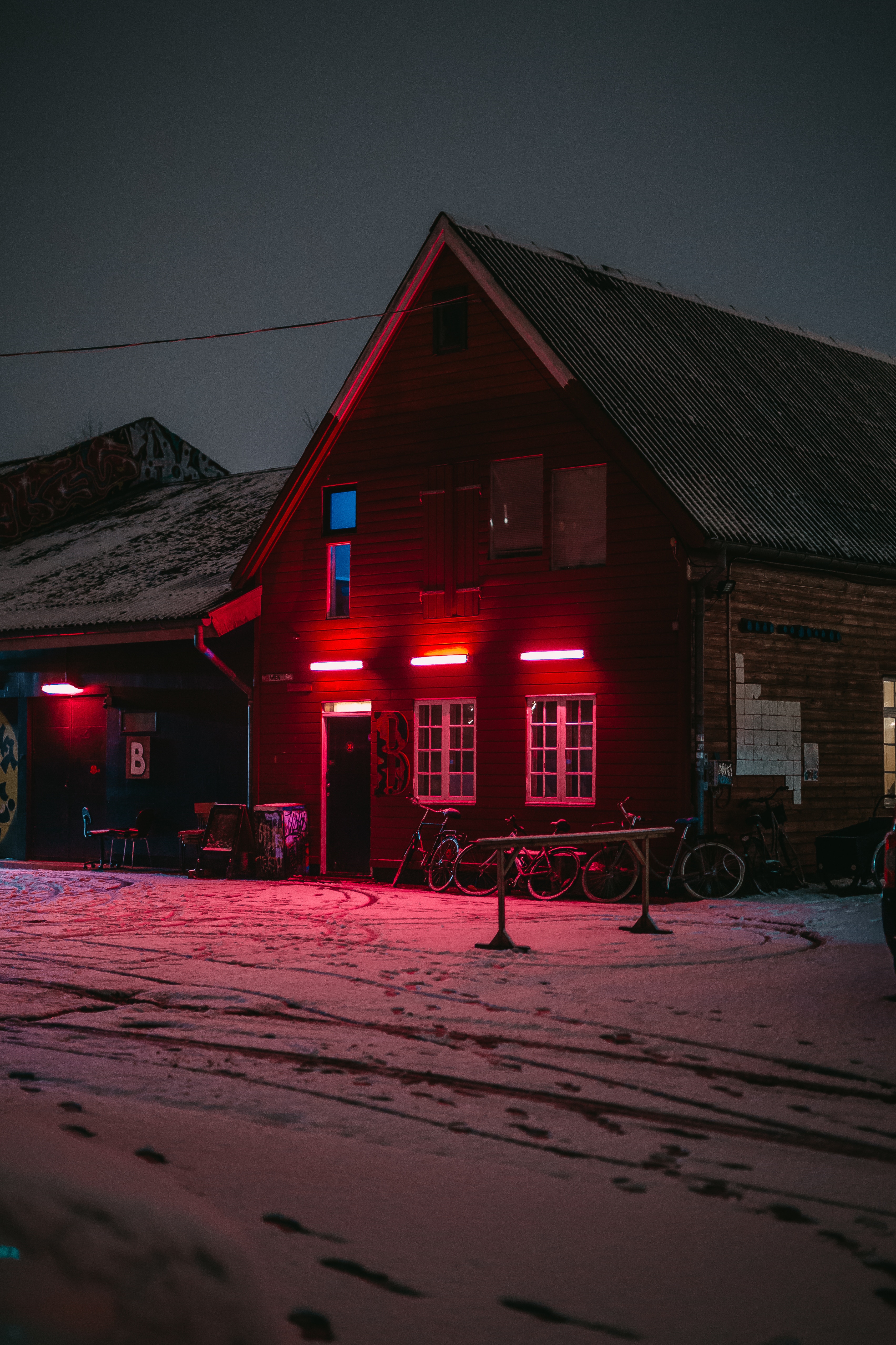 78571 download wallpaper dark, winter, bicycles, red, shine, light, small house, lodge screensavers and pictures for free