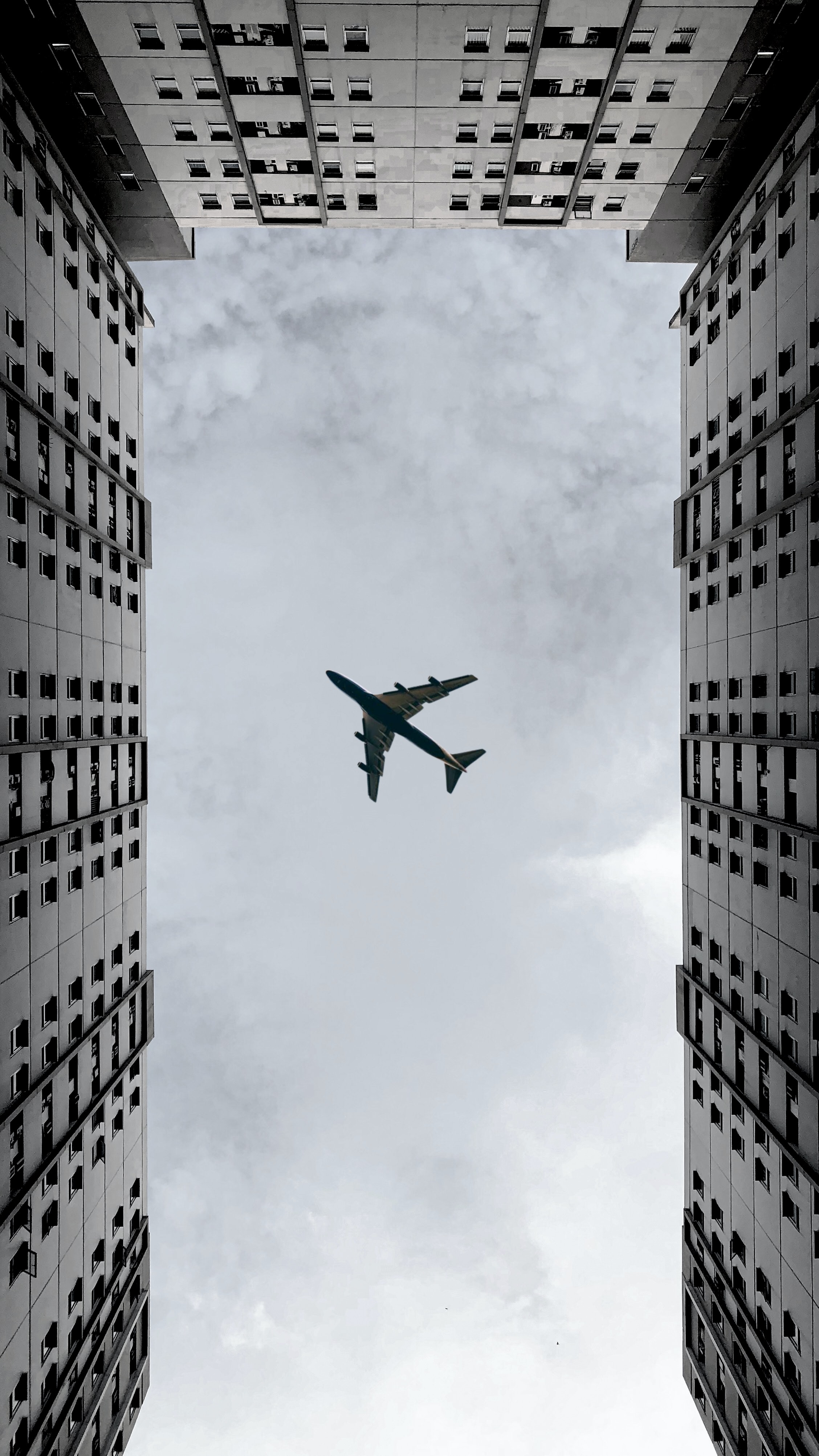 plane, grey, clouds, building, miscellanea, miscellaneous, airplane, bottom view