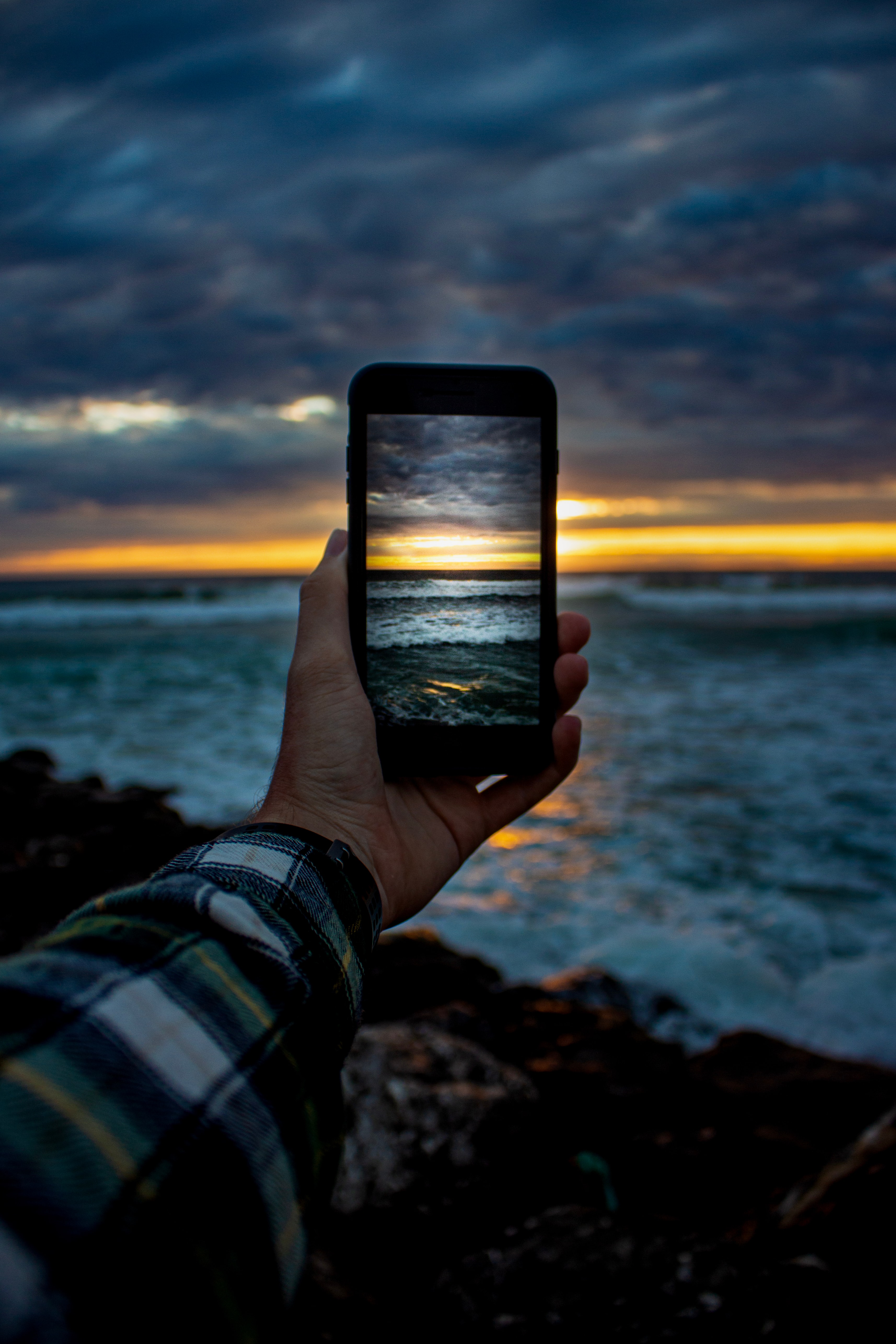 102741 Screensavers and Wallpapers Shooting for phone. Download sunset, sea, hand, miscellanea, miscellaneous, shooting, survey, telephone pictures for free