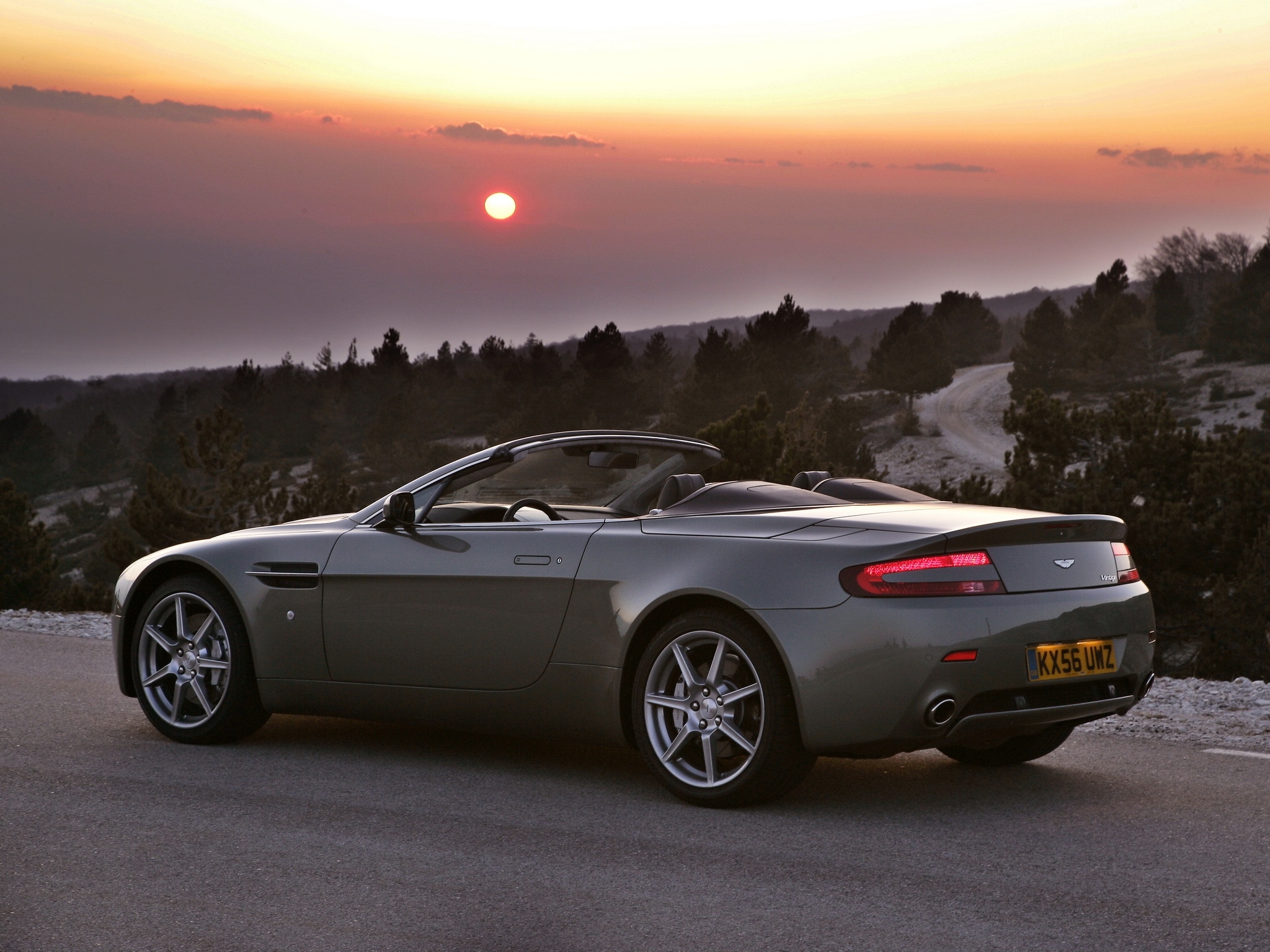 100828 download wallpaper auto, trees, sunset, aston martin, cars, grey, side view, v8, 2006 screensavers and pictures for free