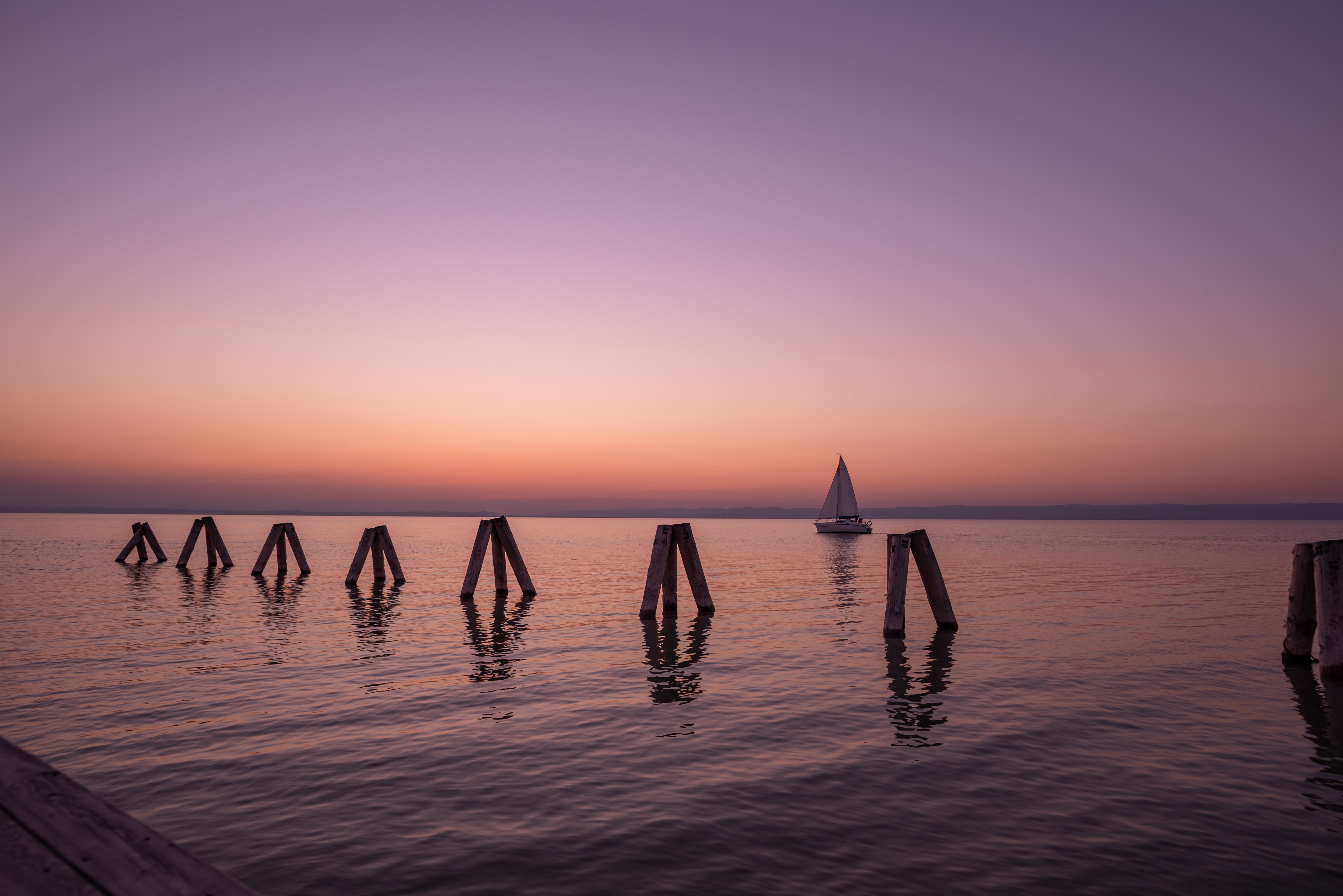 Widescreen image lake, boat, neuzidlerzee, sunset