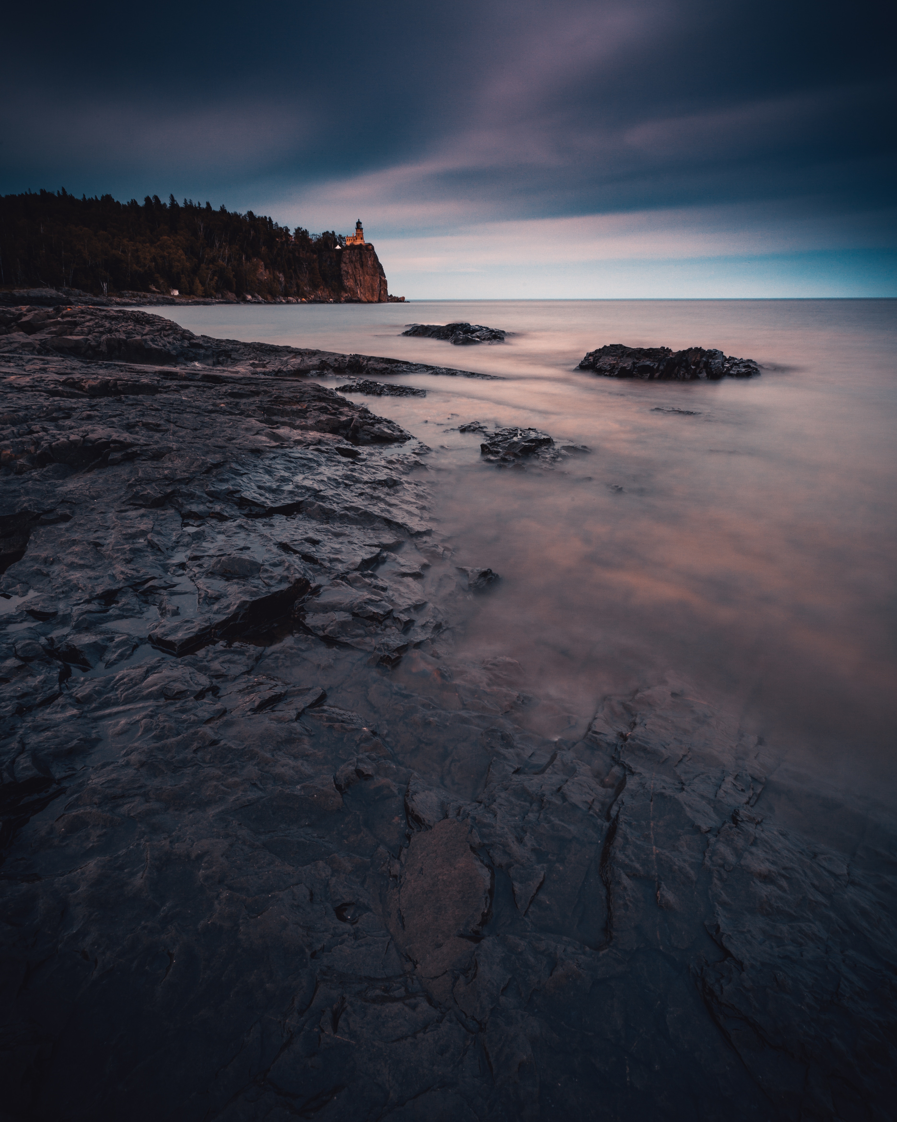 stones, shore, nature, water, sunset, sea, bank, fog Phone Background