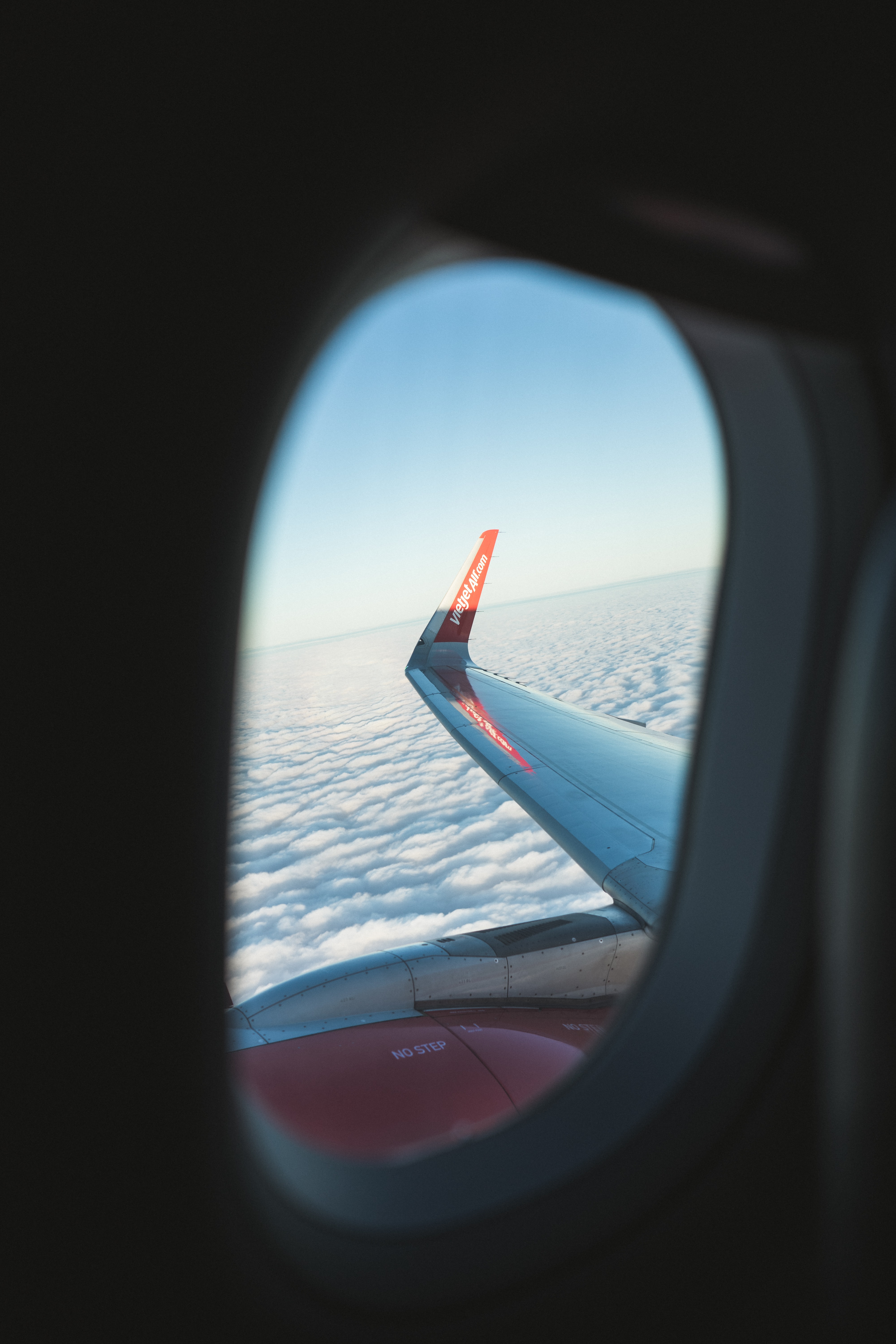 Mobile wallpaper: Porthole, View, Wing, Clouds, Window, Miscellaneous,  Airplane, Miscellanea, Plane, 155455 download the picture for free.