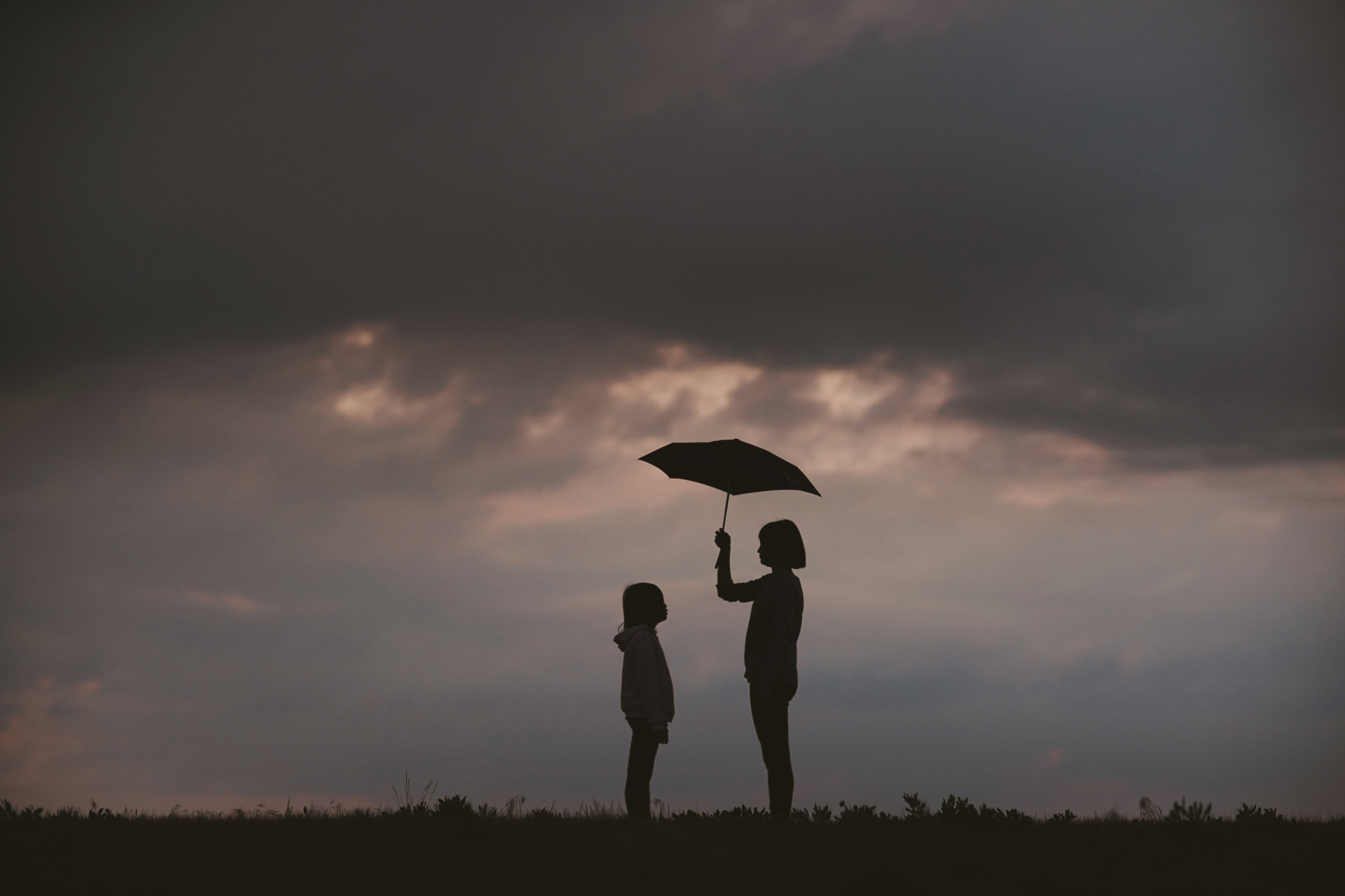 152444 Screensavers and Wallpapers Child for phone. Download sky, dark, silhouettes, care, umbrella, child, mother pictures for free