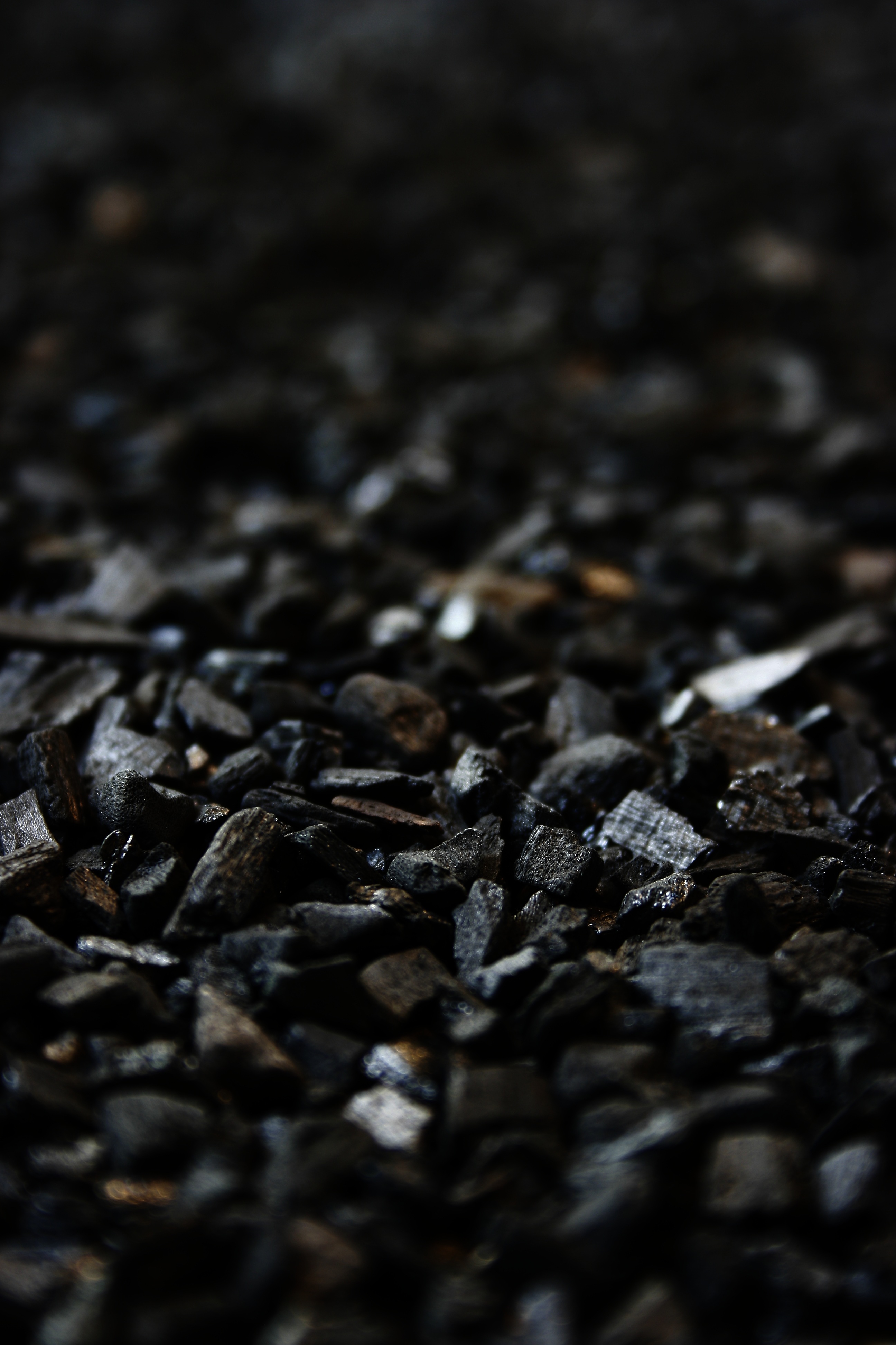 68650 download wallpaper carbon, stones, black, macro, angle, corner screensavers and pictures for free