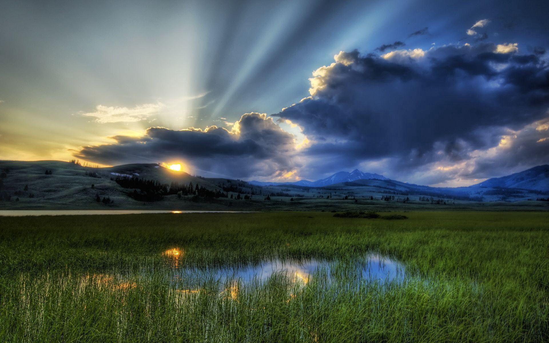 69576 download wallpaper nature, sky, mountains, sun, clouds, swamp, beams, rays, reeds screensavers and pictures for free