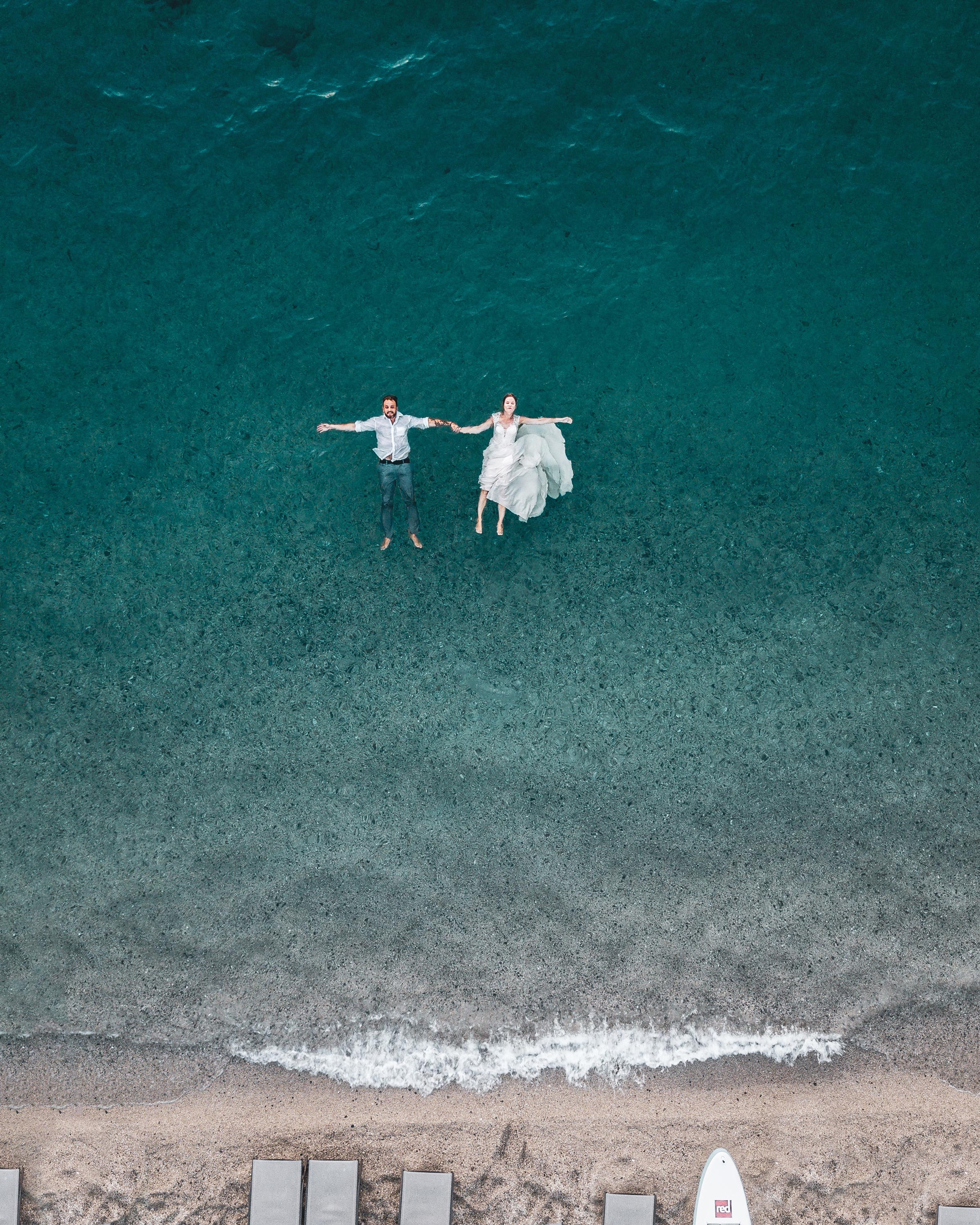 124308 download wallpaper couple, water, love, view from above, pair, romance screensavers and pictures for free