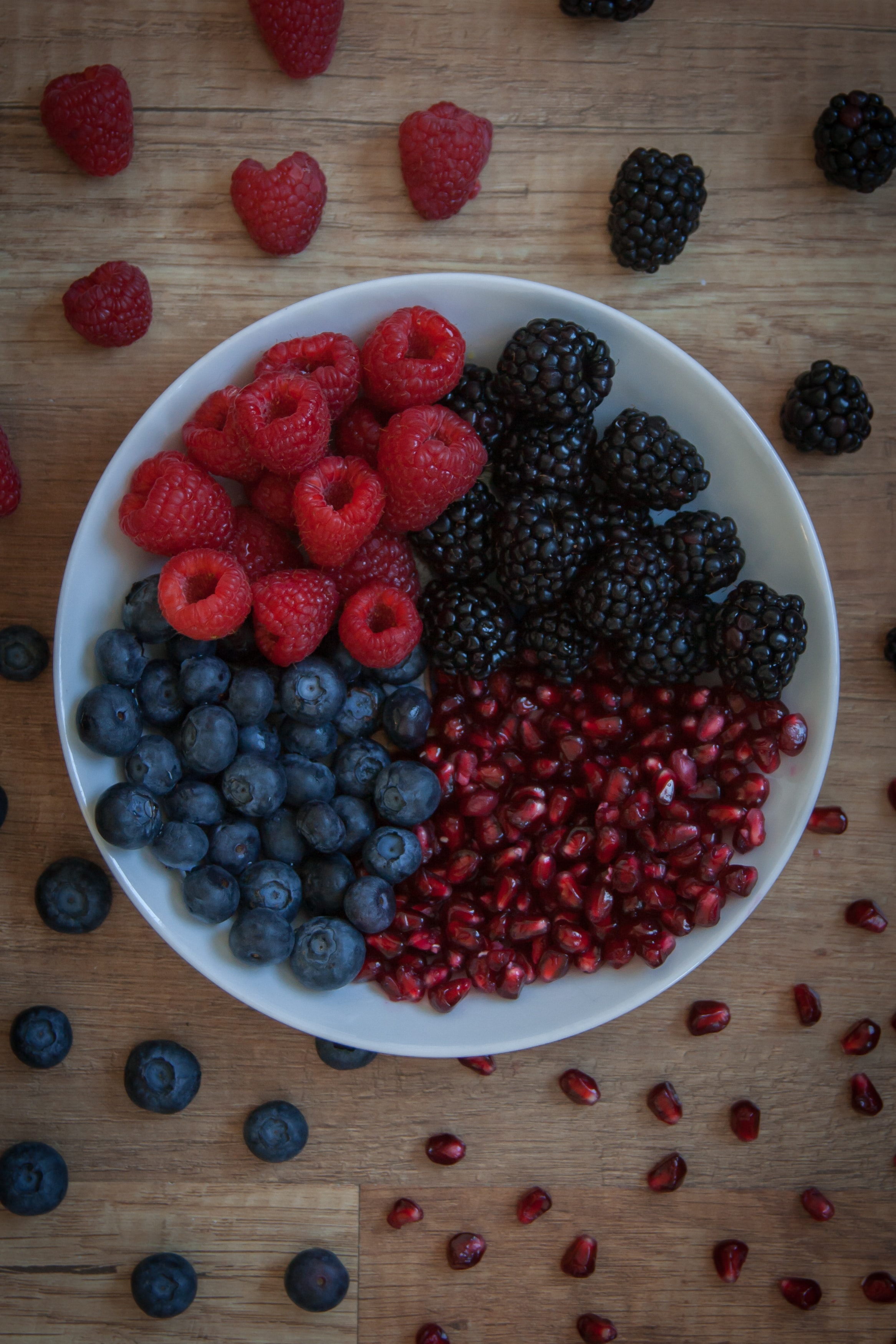vertical wallpaper berries, food, raspberry, bilberries, blackberry, bowl, garnet, pomegranate