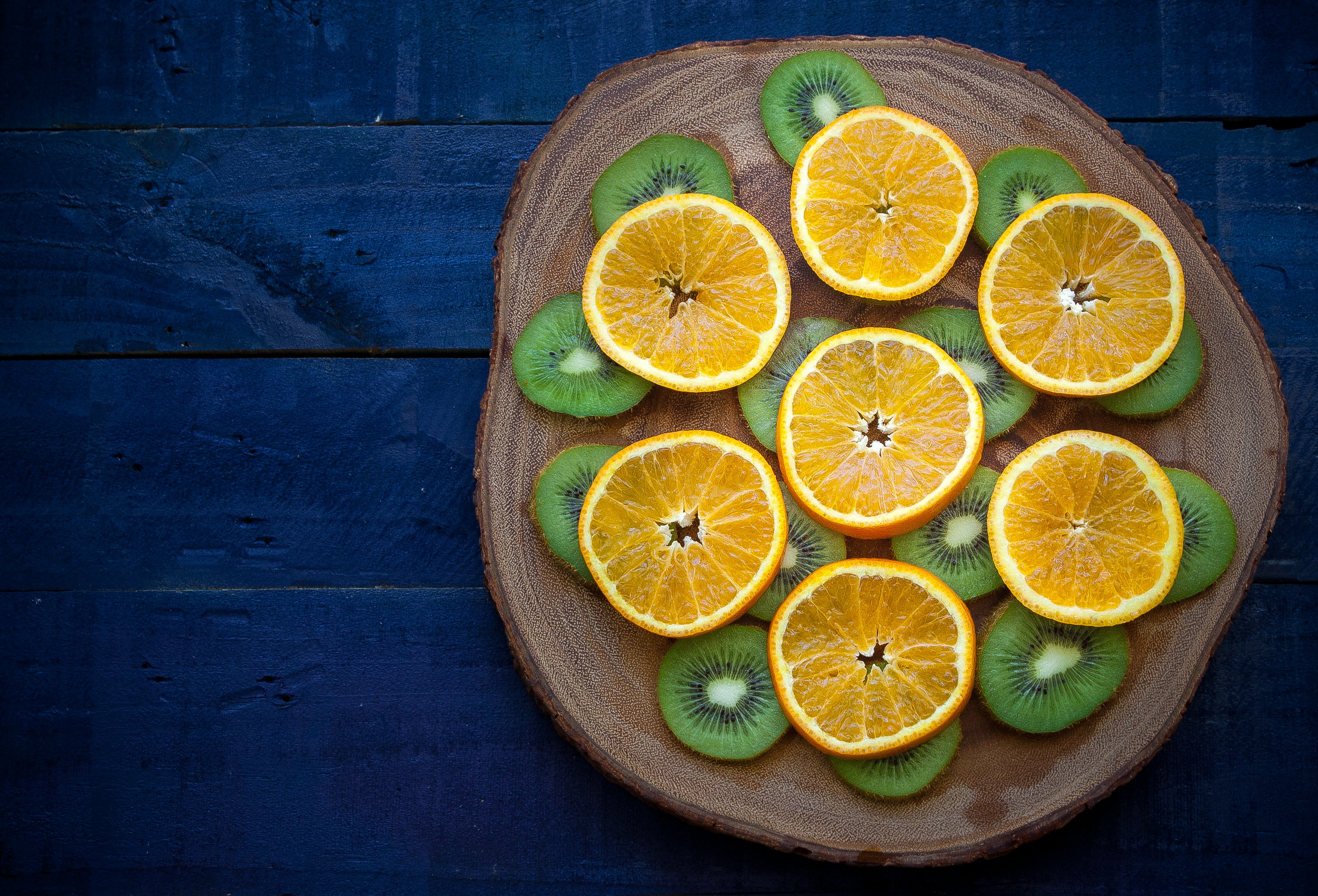 56322 download wallpaper food, oranges, kiwi, slicing, rifling, cutting board screensavers and pictures for free