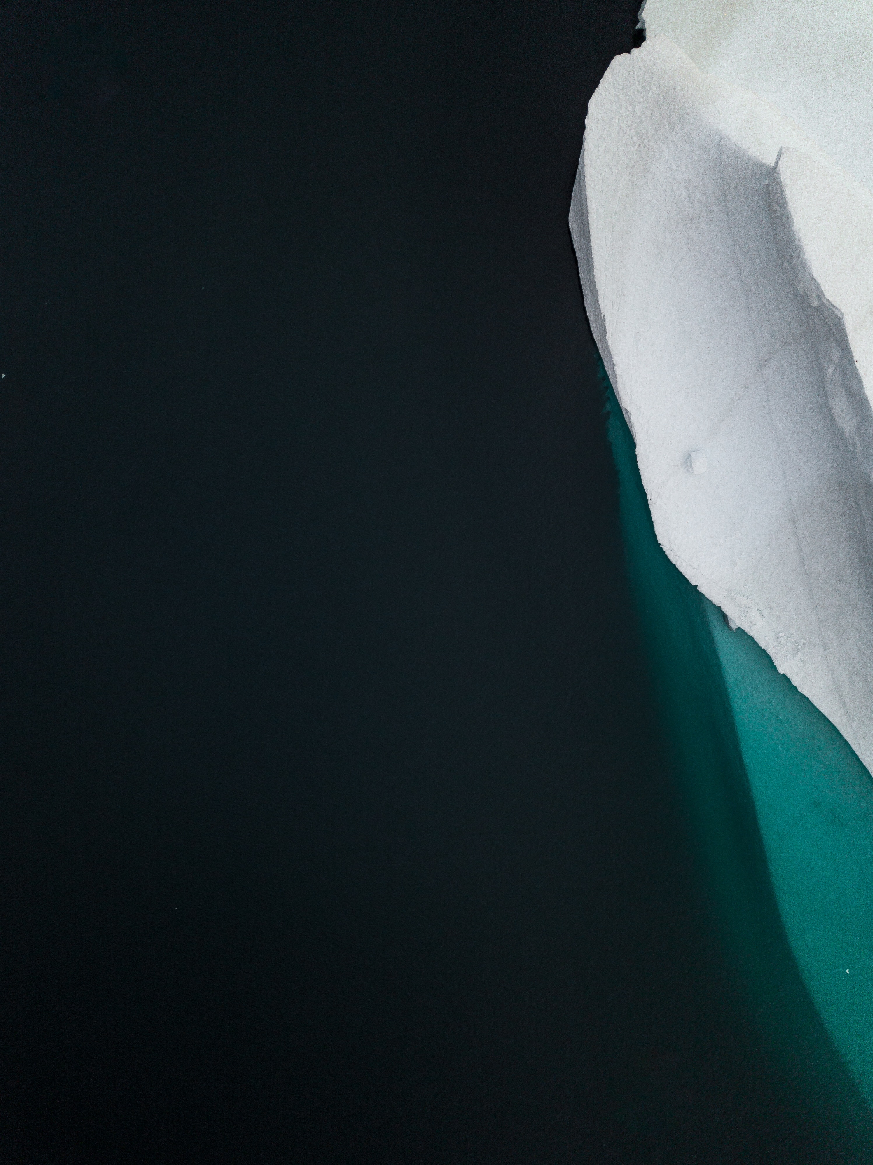 Widescreen image iceberg, minimalism, view from above, water