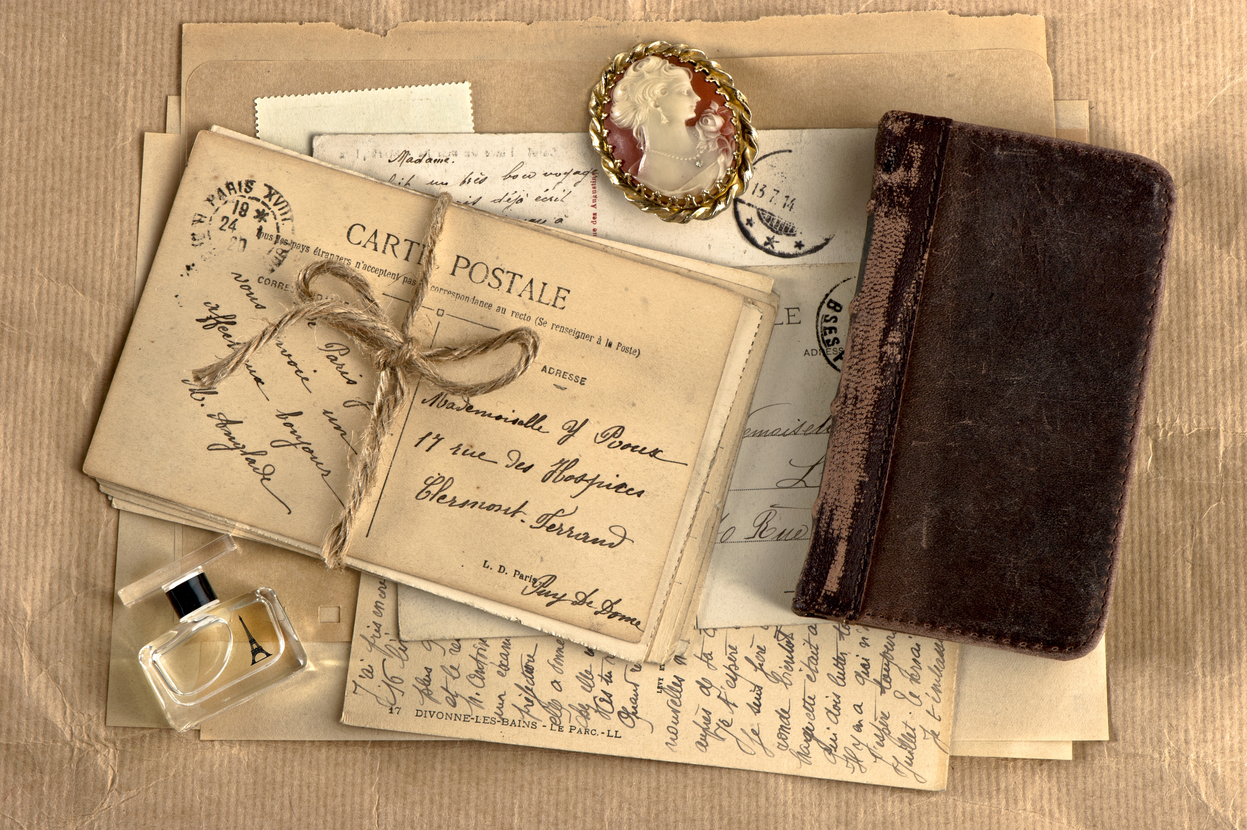 64895 download wallpaper notebook, miscellanea, miscellaneous, vintage, retro, letters, notepad, medallion, perfume screensavers and pictures for free