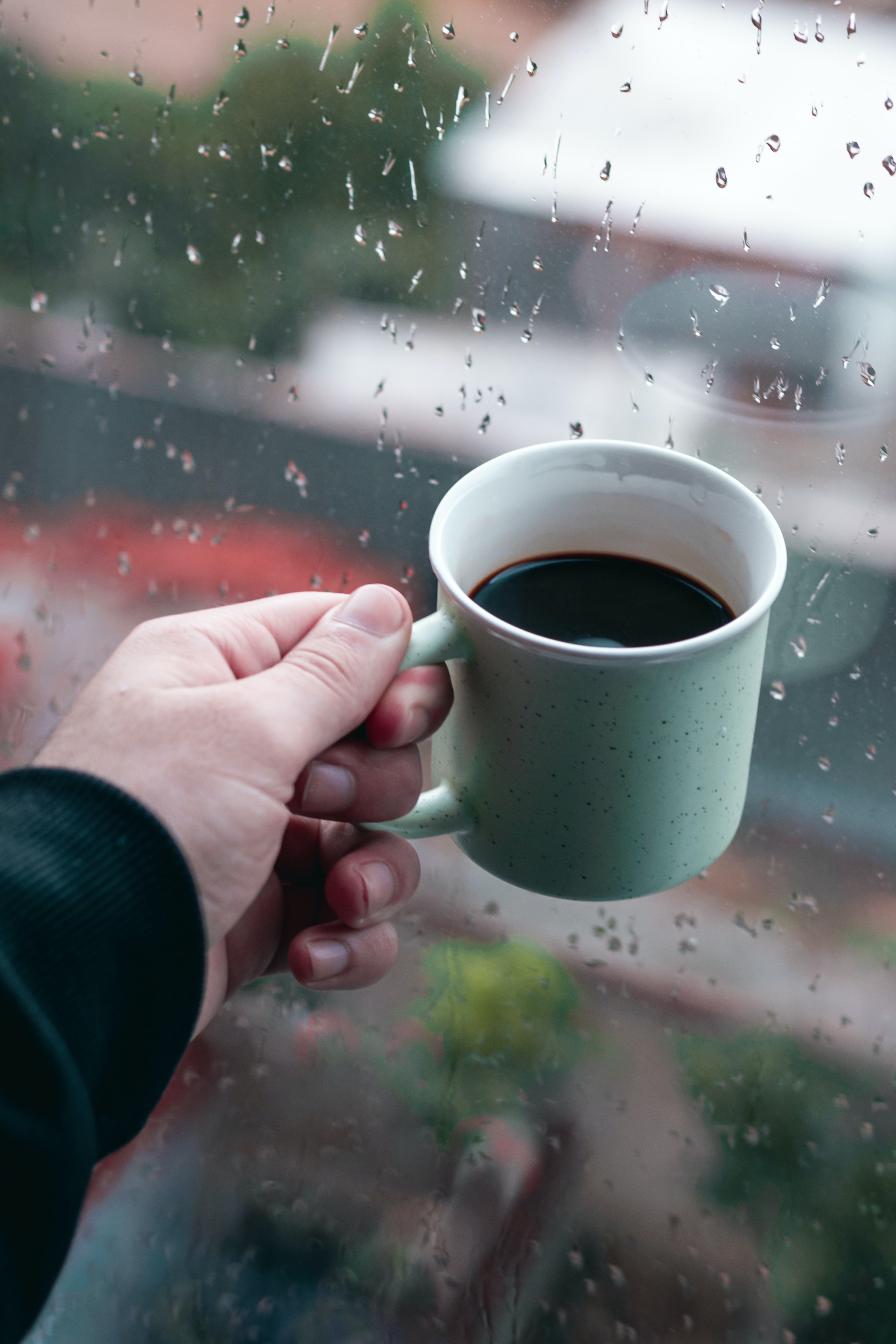 100167 download wallpaper coffee, rain, hand, miscellanea, miscellaneous, cup, window, mug screensavers and pictures for free
