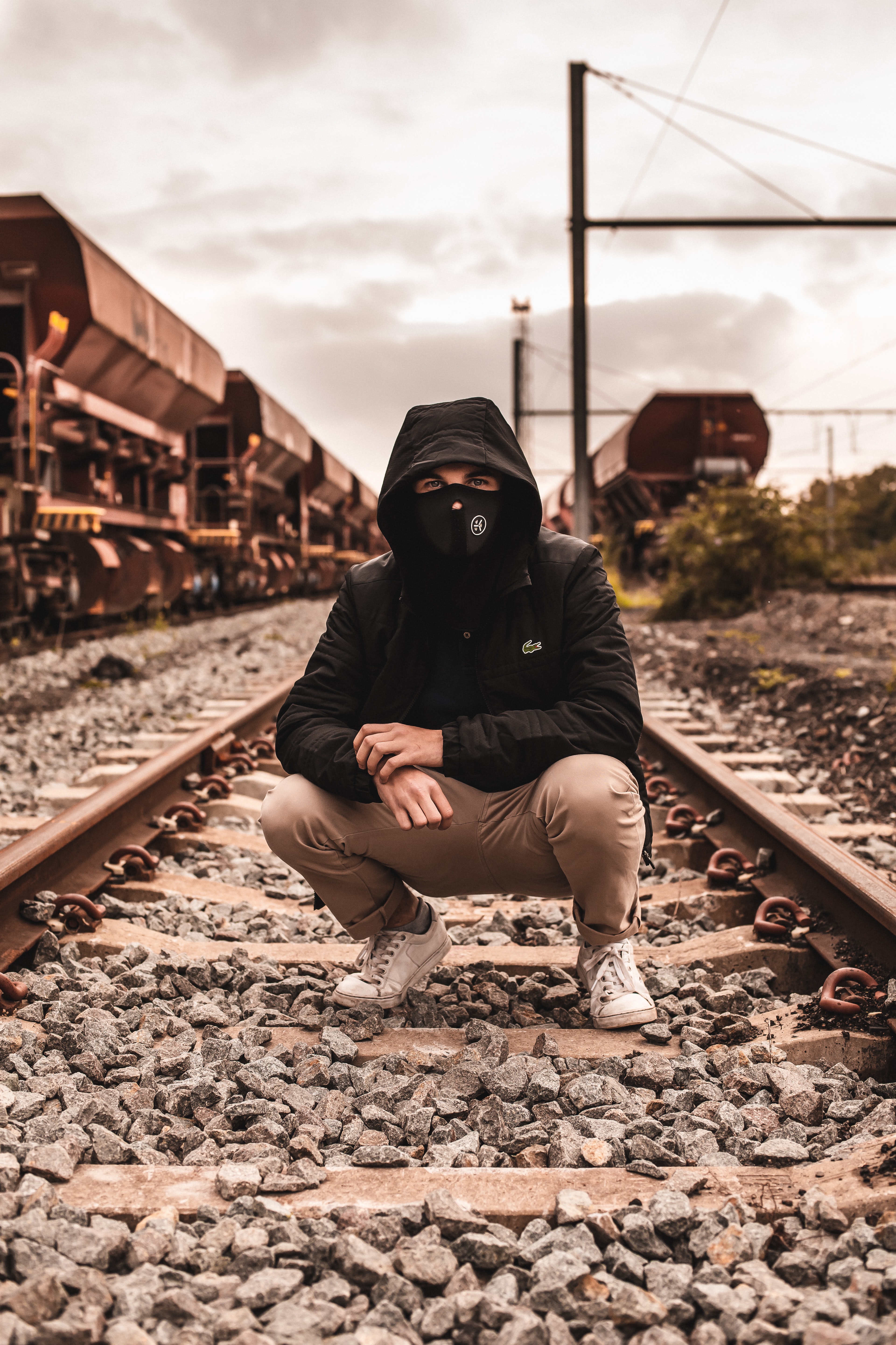 136364 Screensavers and Wallpapers Man for phone. Download miscellanea, miscellaneous, man, mask, railway, hood, rails pictures for free