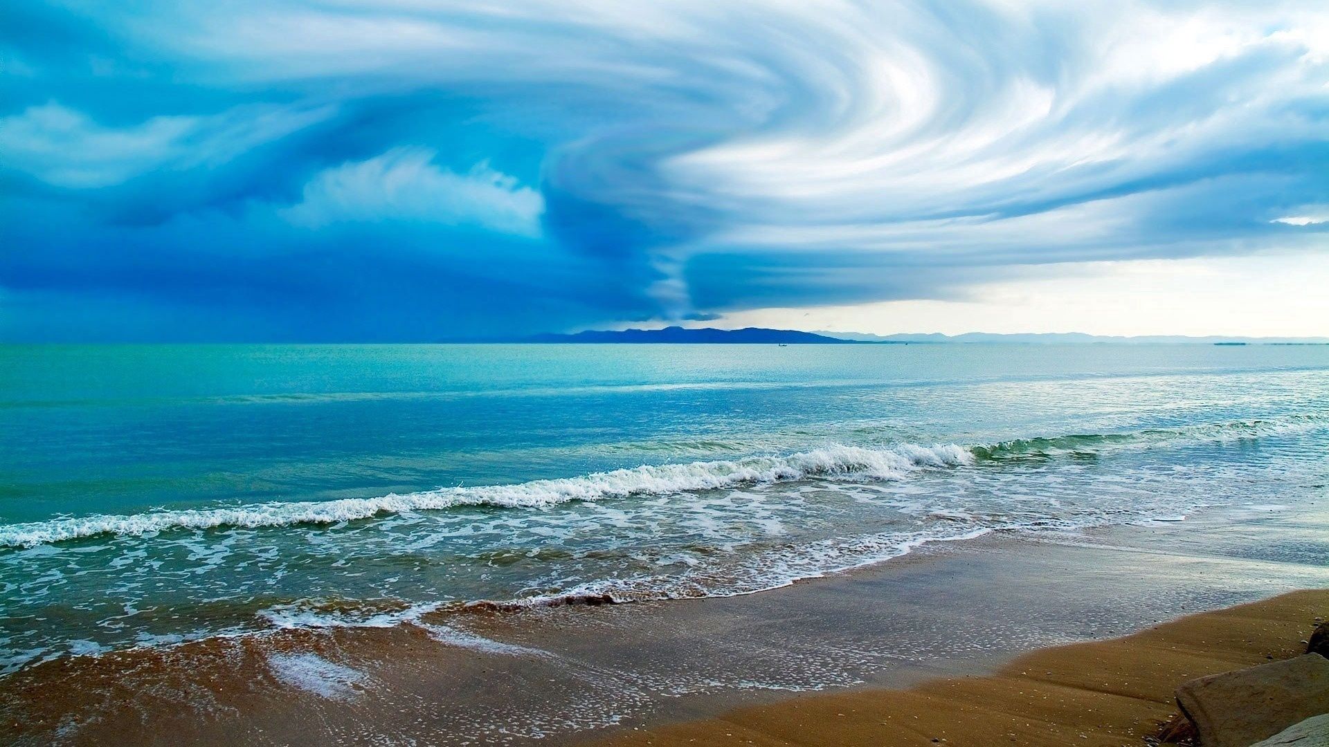 Widescreen image typhoon, shore, ocean, clouds