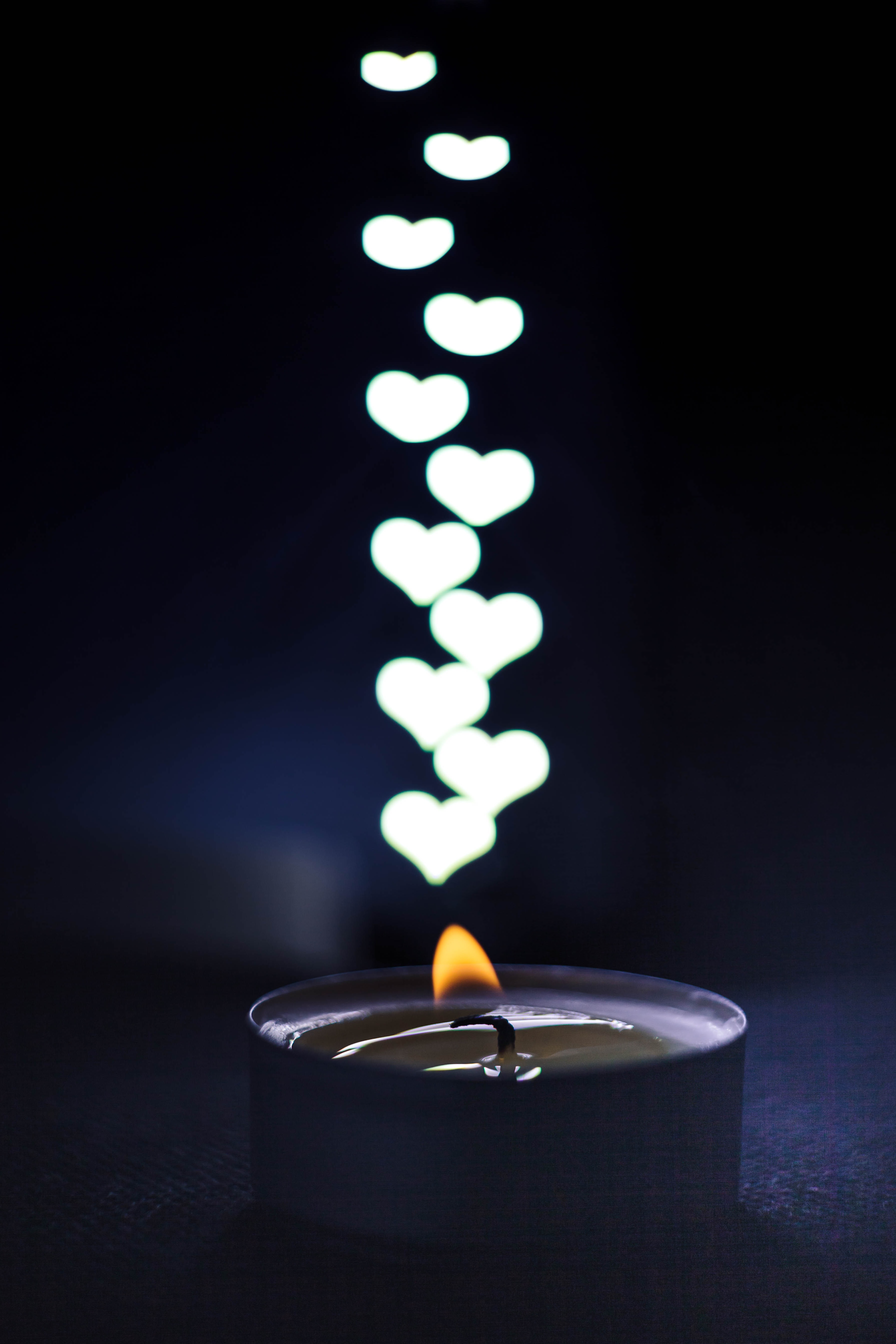 Download mobile wallpaper Heart, Glare, Flame, Candle, Dark for free.