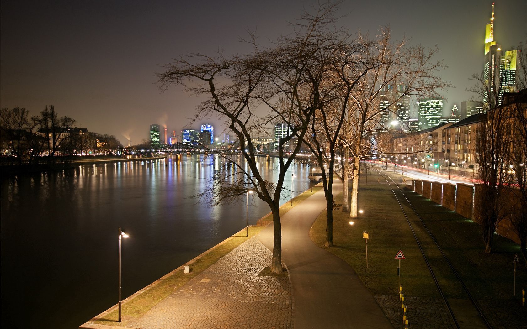 cities, water, houses, trees, lights, pier, road, lanterns, wall, skyscrapers, evening, life, dahl, distance, square, wharf, mostovaya, pavement, channel, buildings, strait, frankfurt, vessel, railways, railroads, built for android