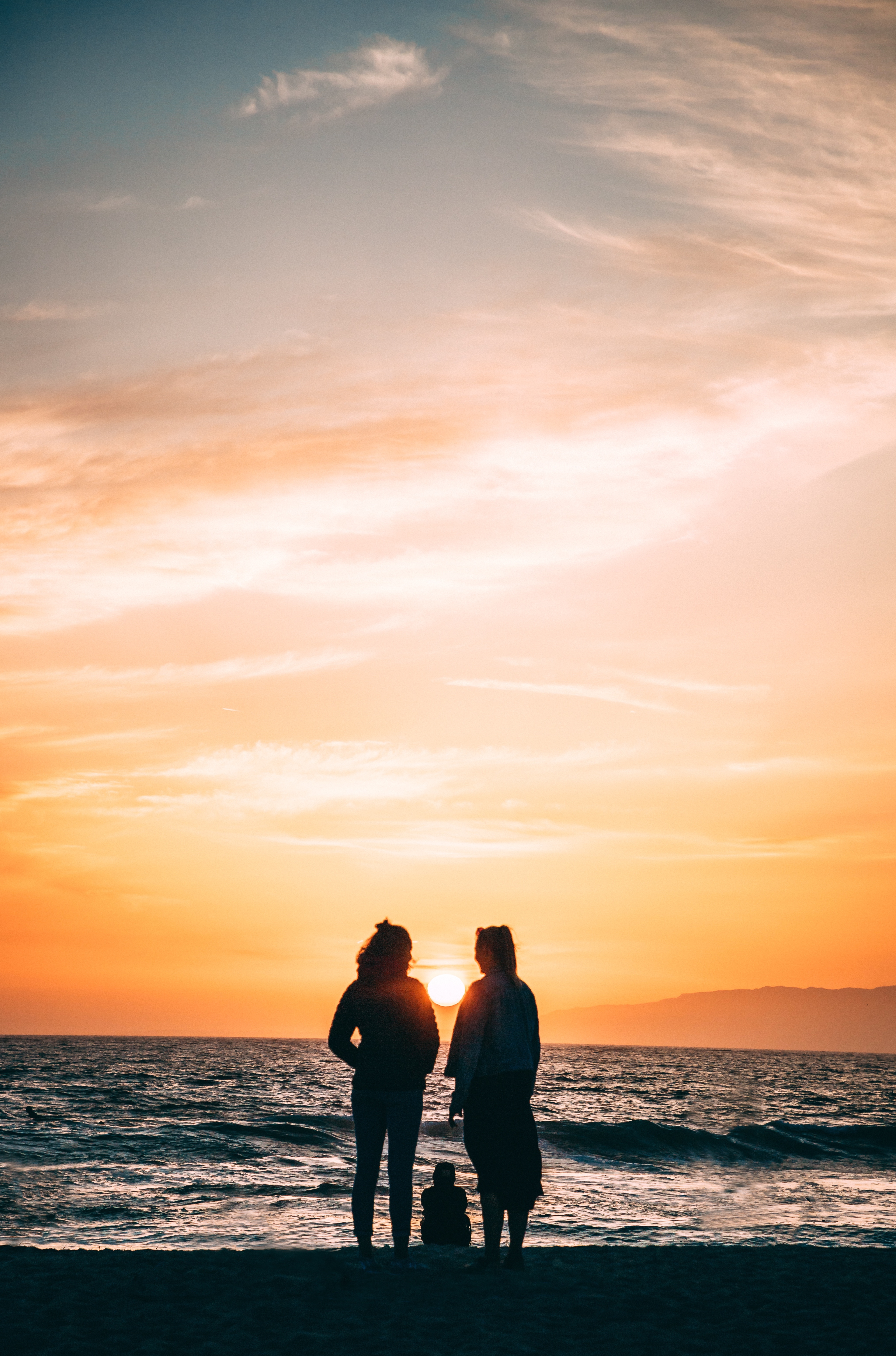 family, nature, sunset, sea, bank, shore, silhouettes phone background