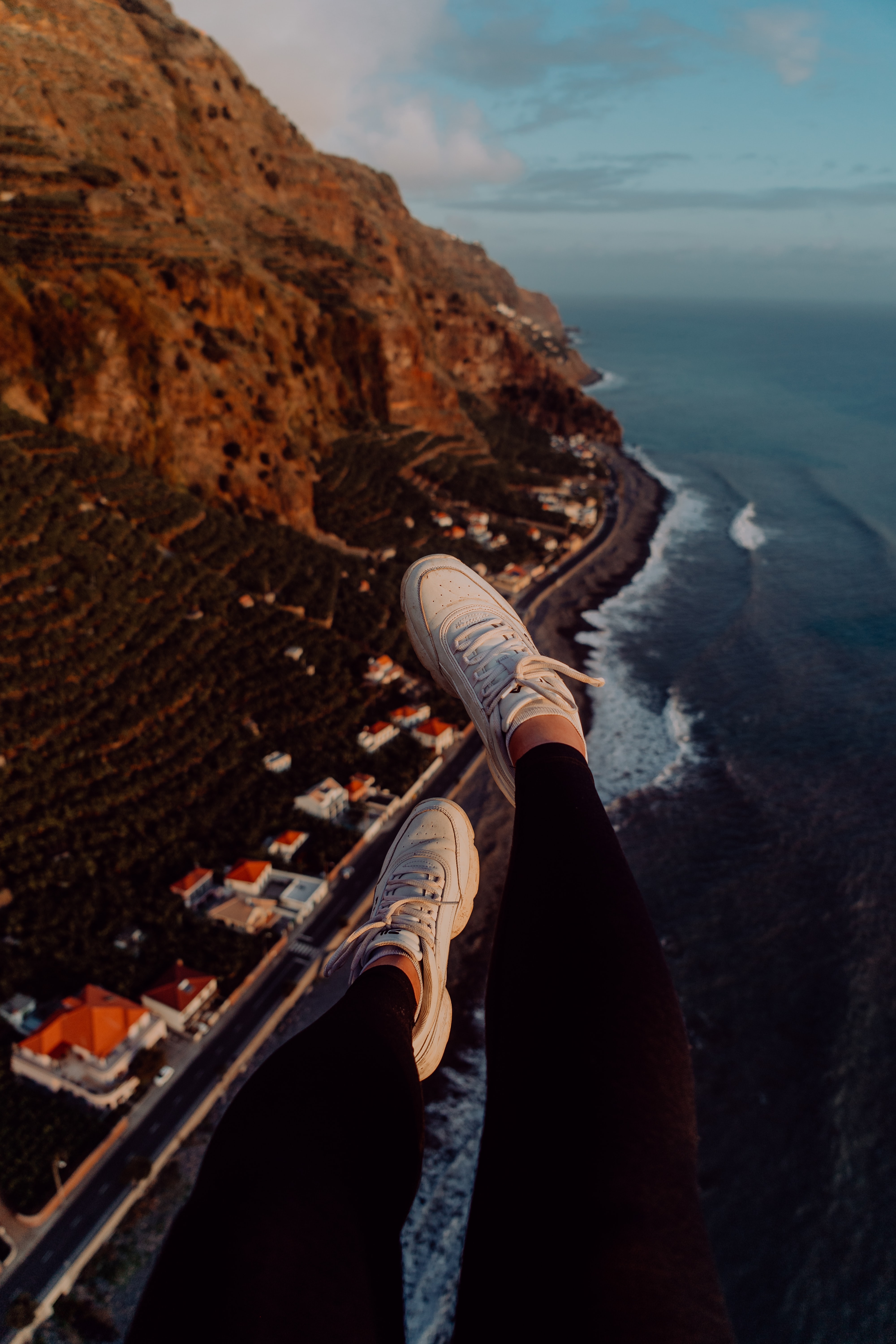 mountains, city, view from above, coast, miscellanea, miscellaneous, legs, sneakers