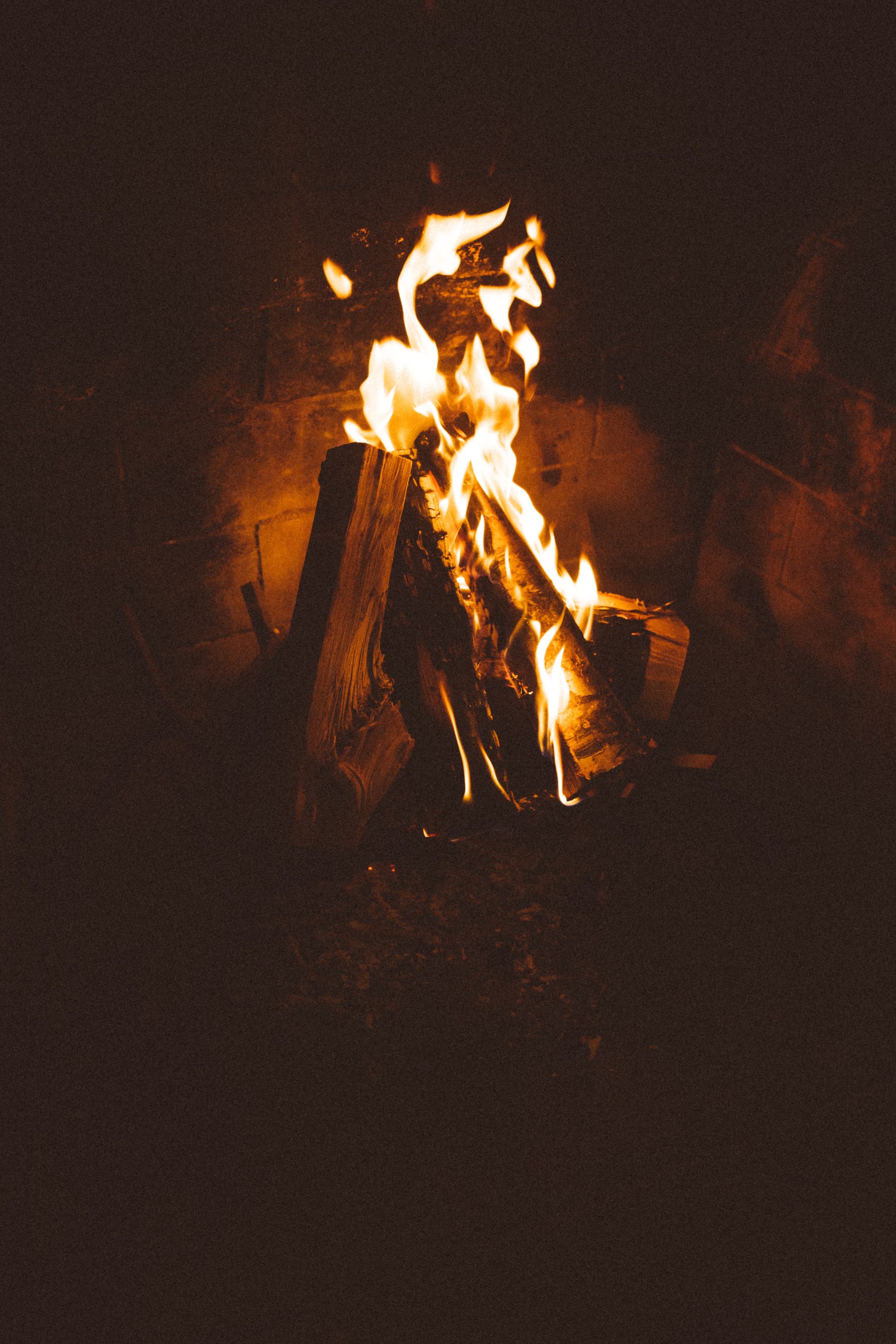 Firewood fireplace, dark, fire, flame 4k Wallpaper