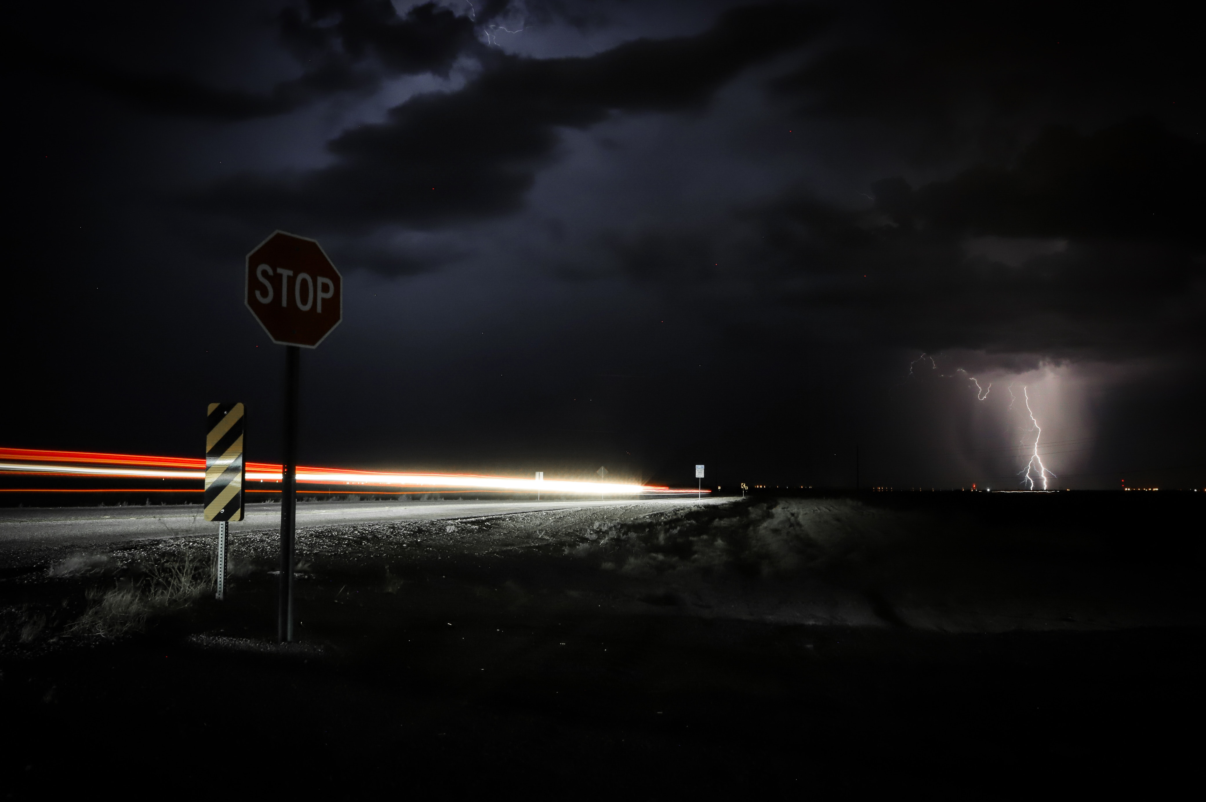 144122 download wallpaper night, signs, dark, road, storm, thunderstorm screensavers and pictures for free