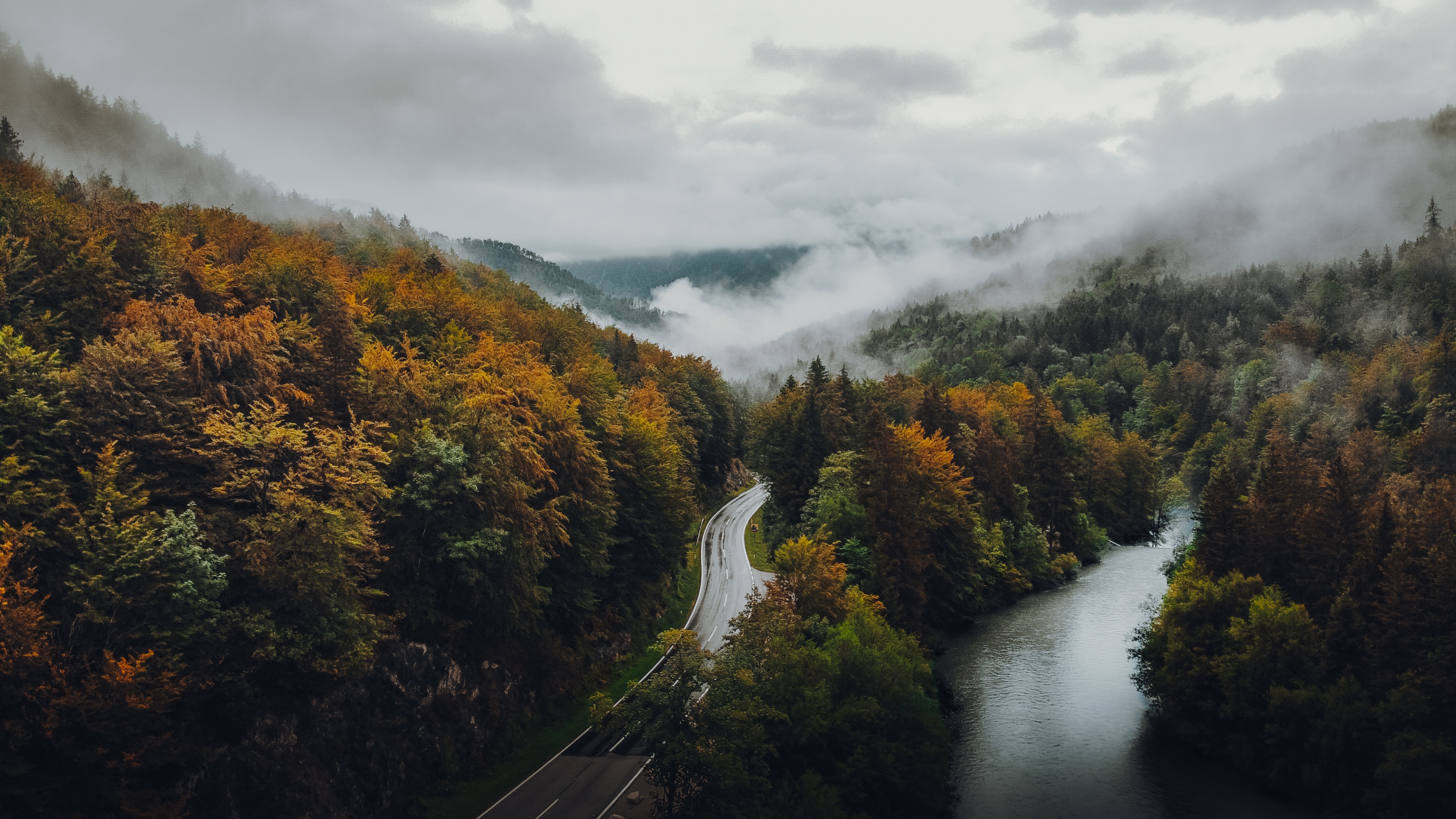 Download mobile wallpaper Road, Clouds, Nature, Autumn, Forest, Fog for free.