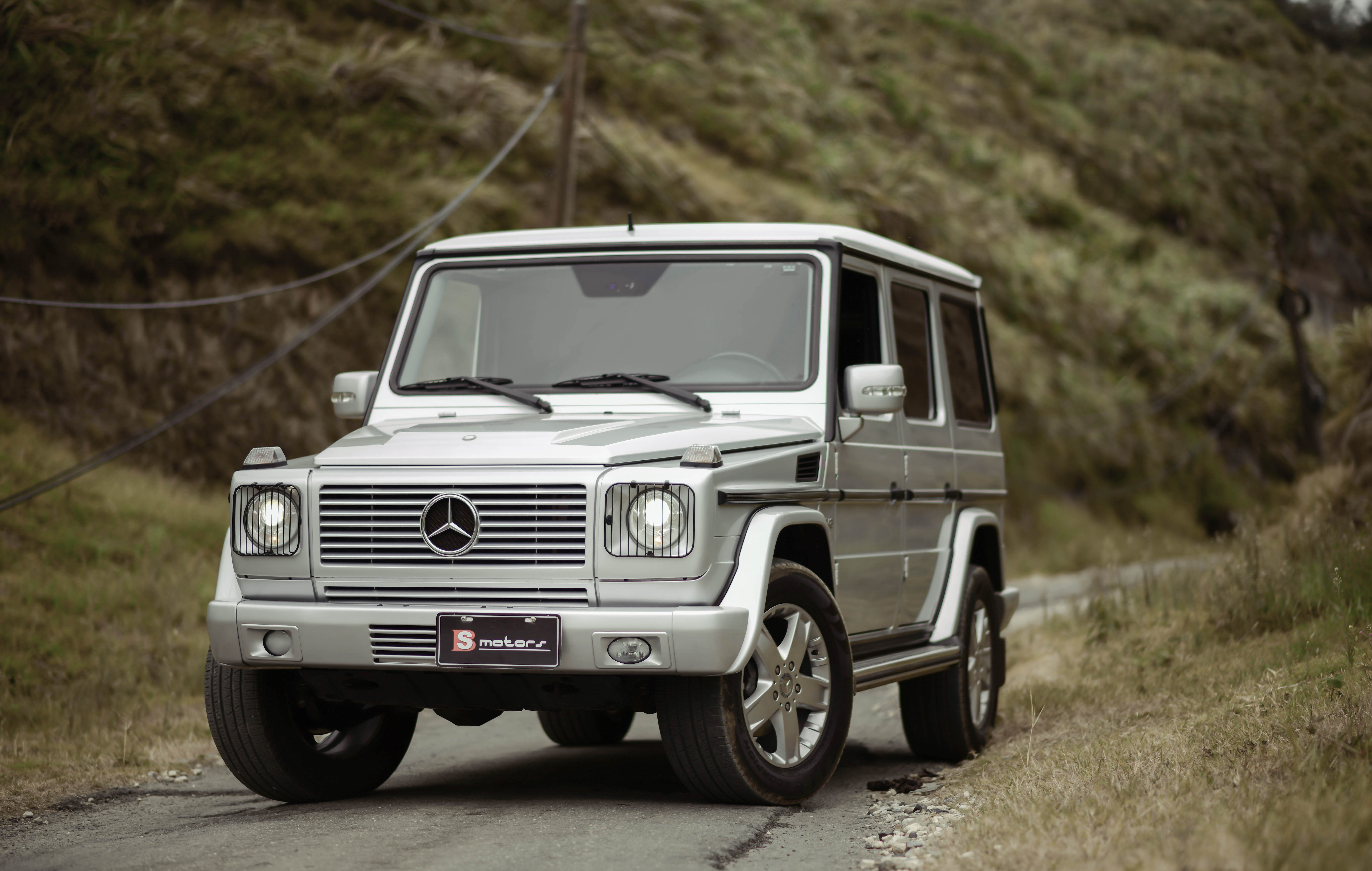 106414 Screensavers and Wallpapers Silvery for phone. Download cars, car, suv, front view, machine, grey, mercedes-benz, silver, silvery, mercedes-benz g500 pictures for free