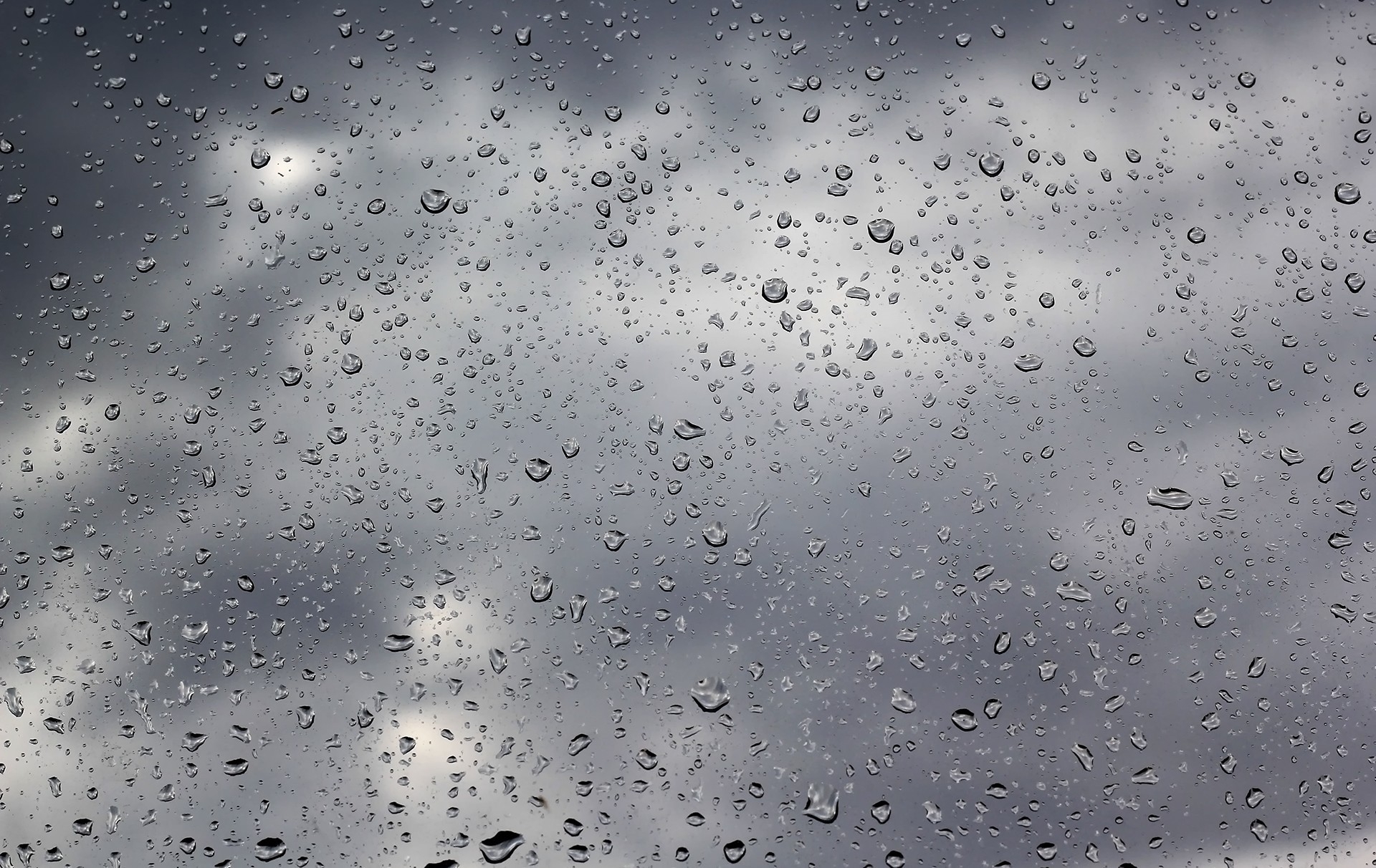 Download mobile wallpaper Rain, Water, Clouds, Drops, Macro, Glass, Mainly Cloudy, Overcast for free.