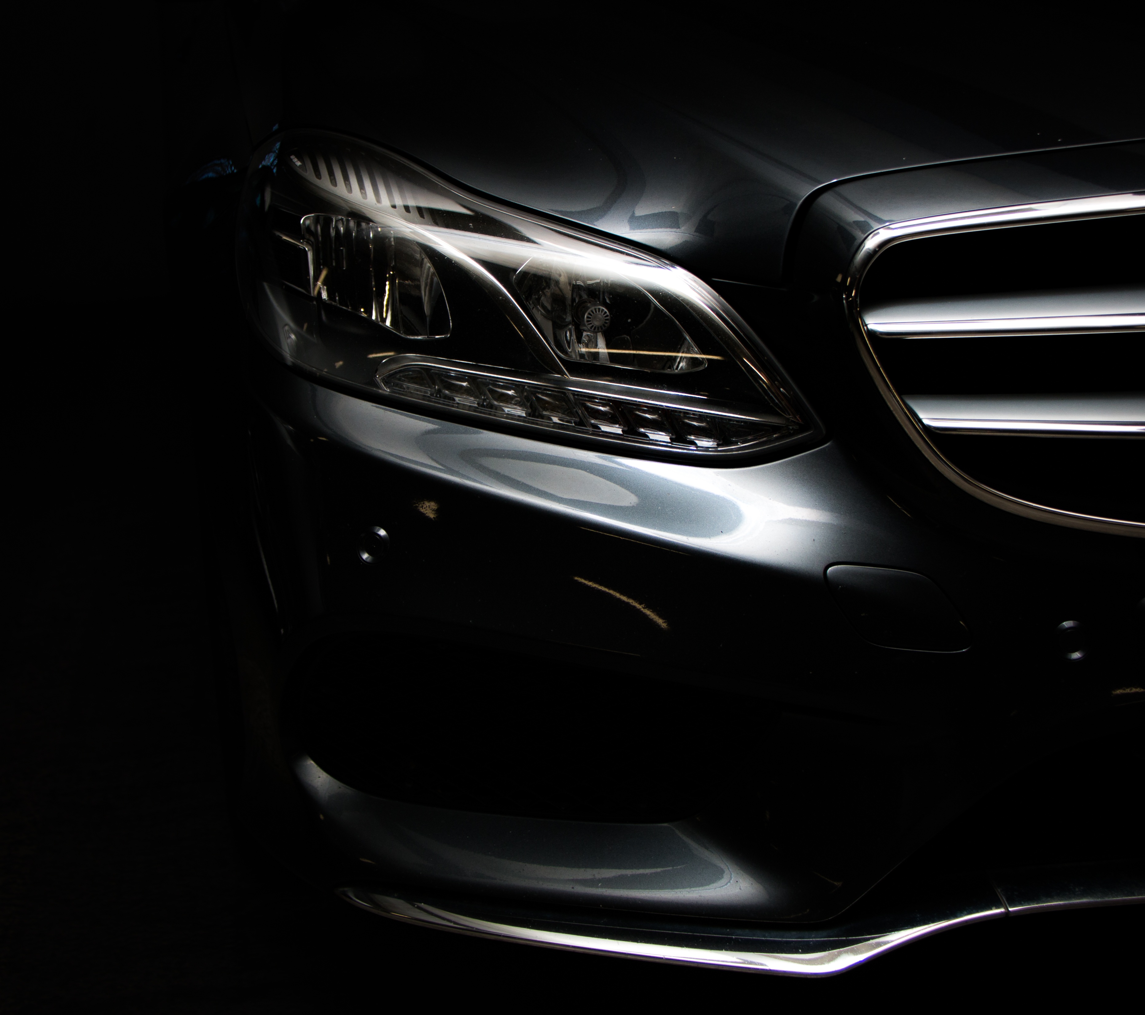 151032 Screensavers and Wallpapers Silver for phone. Download mercedes e-class, cars, dark, front view, mercedes, headlight, bumper, silver, silvery pictures for free